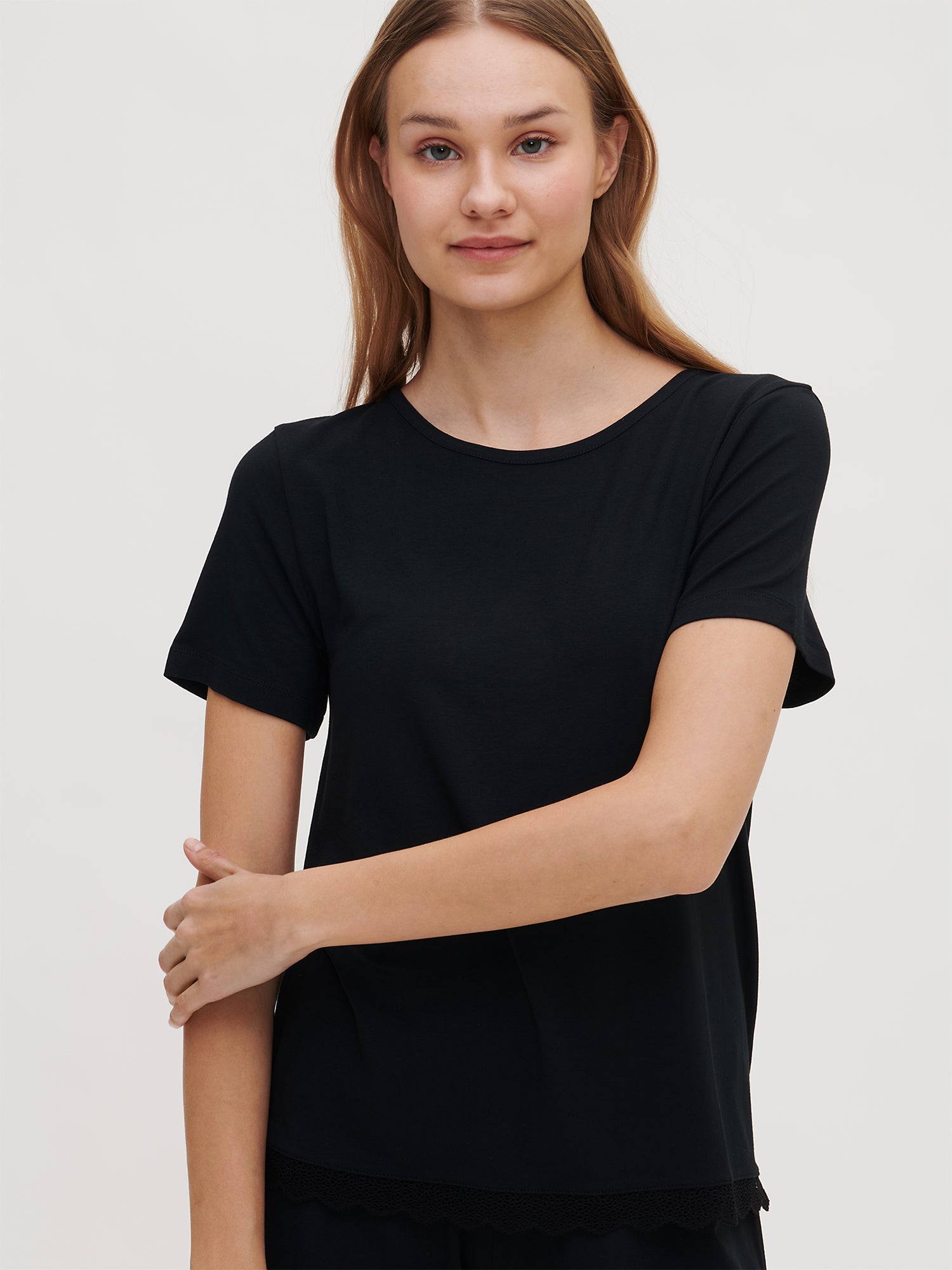 Women's PITSI Shirt in black crafted from a luxurious modal-elastane blend, on a model, close-up.