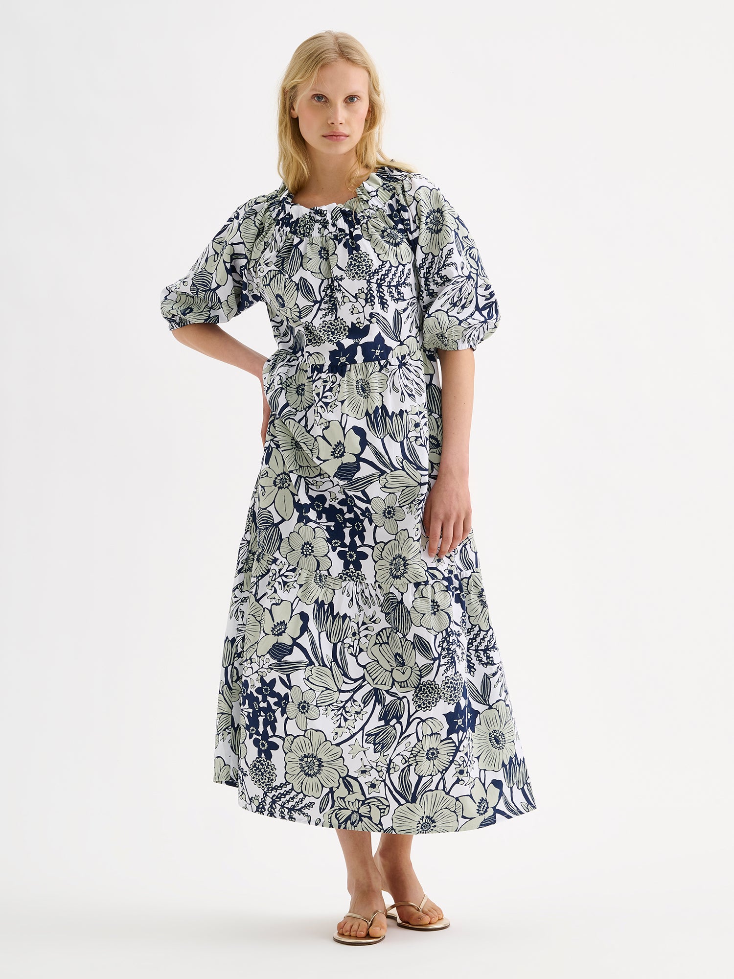 Nanso women's beautifully relaxed floral patterned summer dress, the HUVILA Long Dress, on a model with blonde hair.