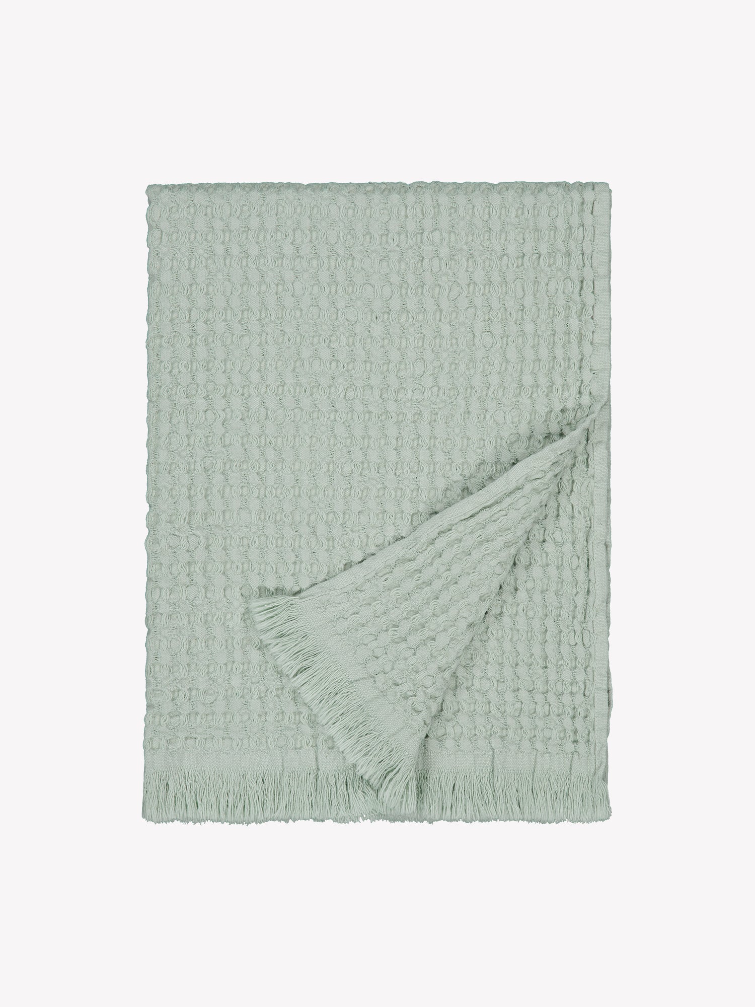 Vohveli hand towel in beautiful light green offers a perfect blend of the nostalgic waffle fabric and modern design, product picture