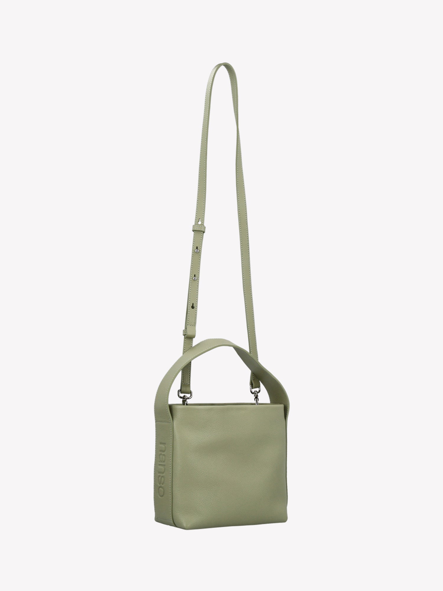 Nanso women’s versatile light green leather bag with a detachable shoulder strap and a top handle – carry it your way, every day. Product picture from the side angle.