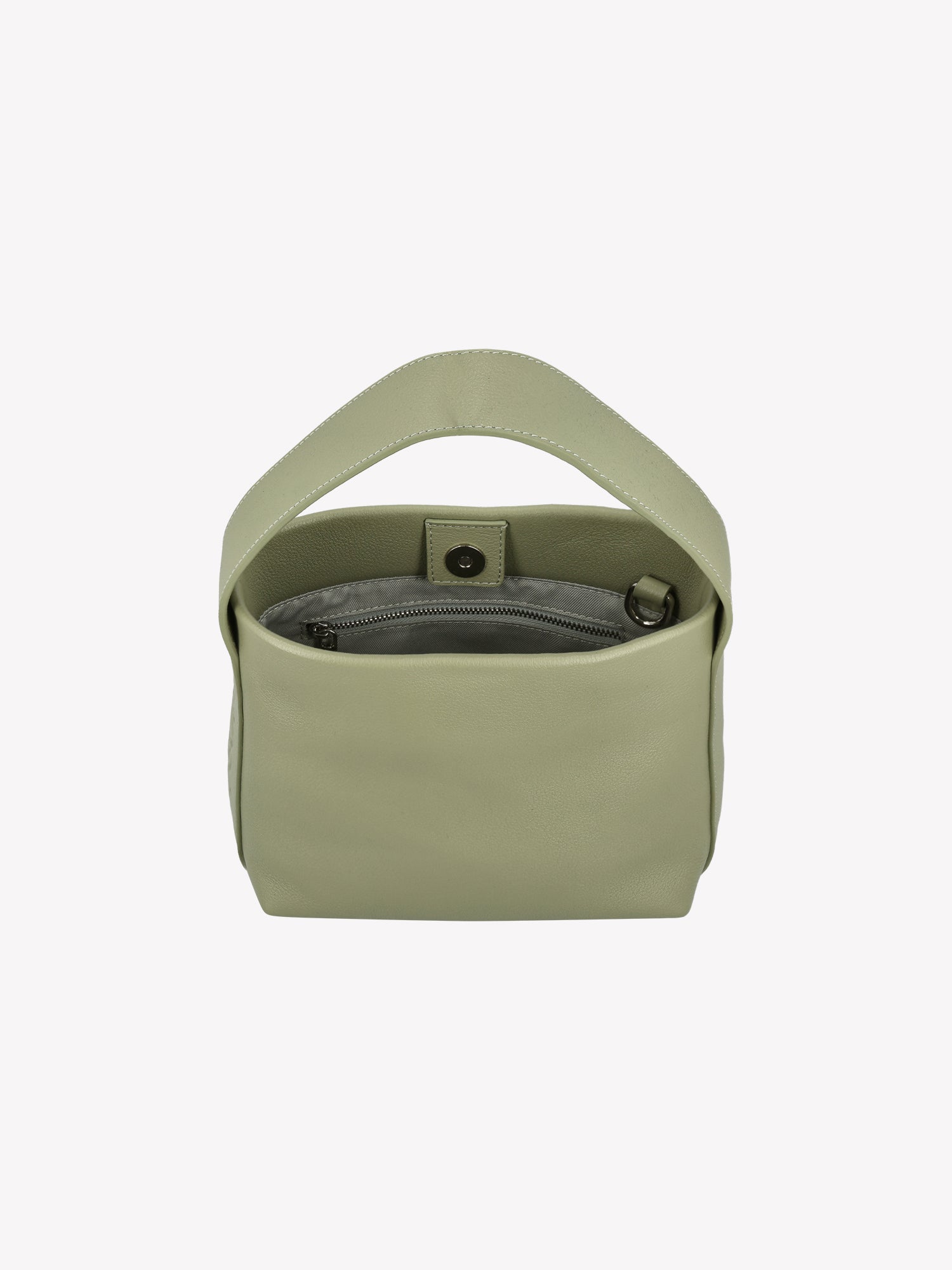 Nanso women’s versatile light green leather bag with a detachable shoulder strap and a top handle – carry it your way, every day. Product picture from the above, inside of the bag seen.