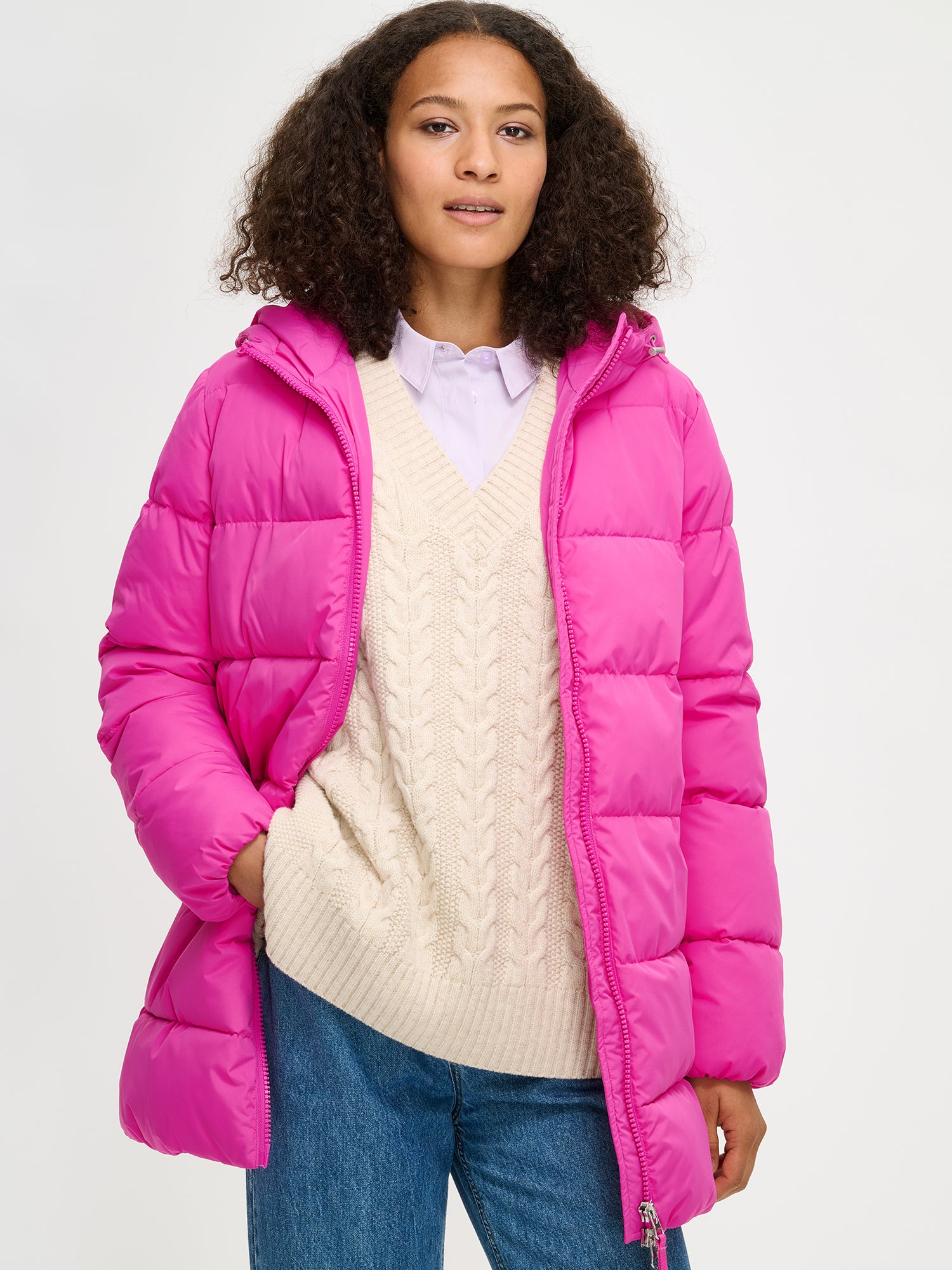 The pink Lumi padded coat provides warmth with its soft, lightweight padding and generous fit, from the front and jacket open.