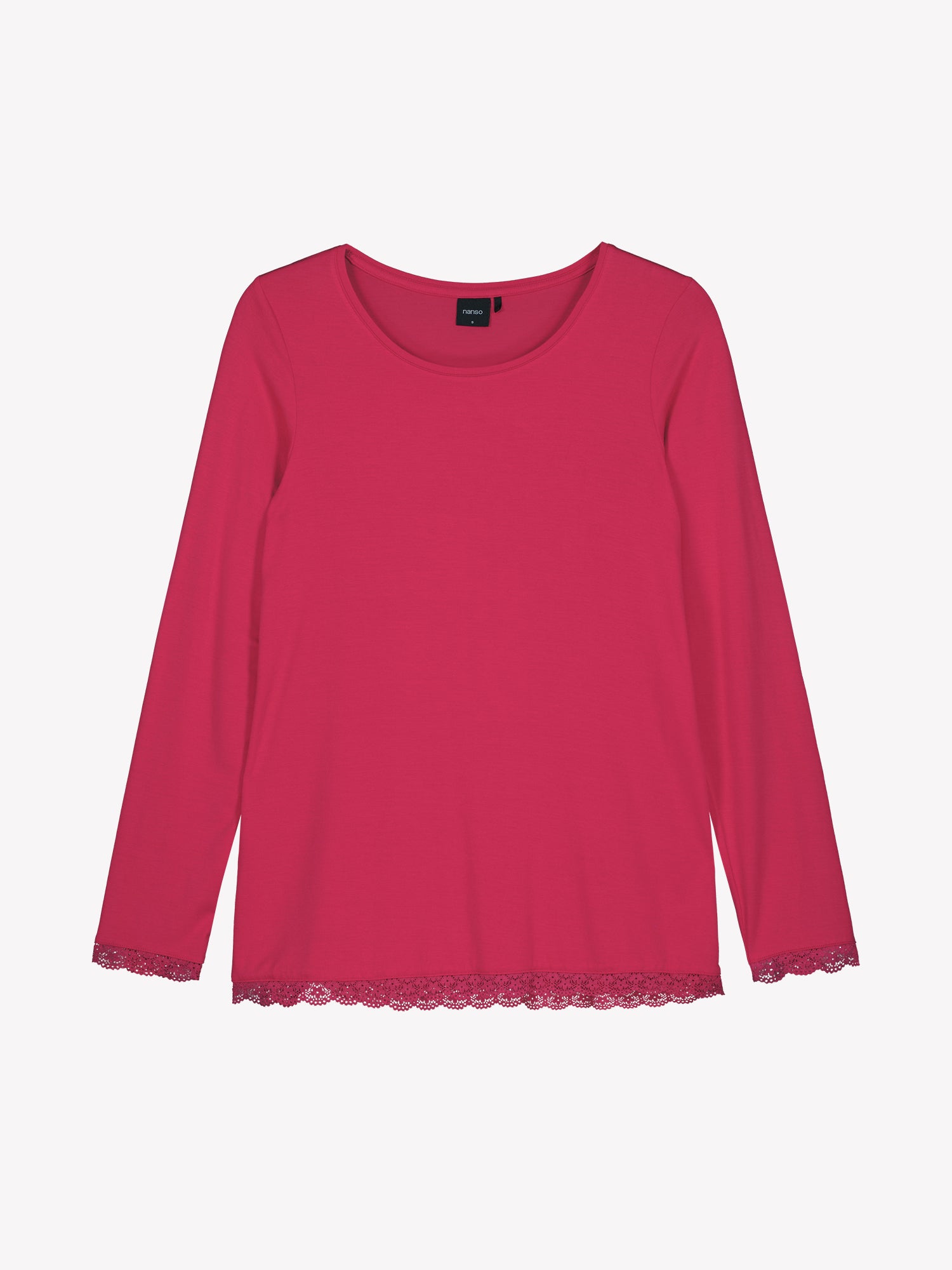 The hem and wristbands of the Pitsi shirt are adorned with timeless lace ribbons as shown in the product picture.