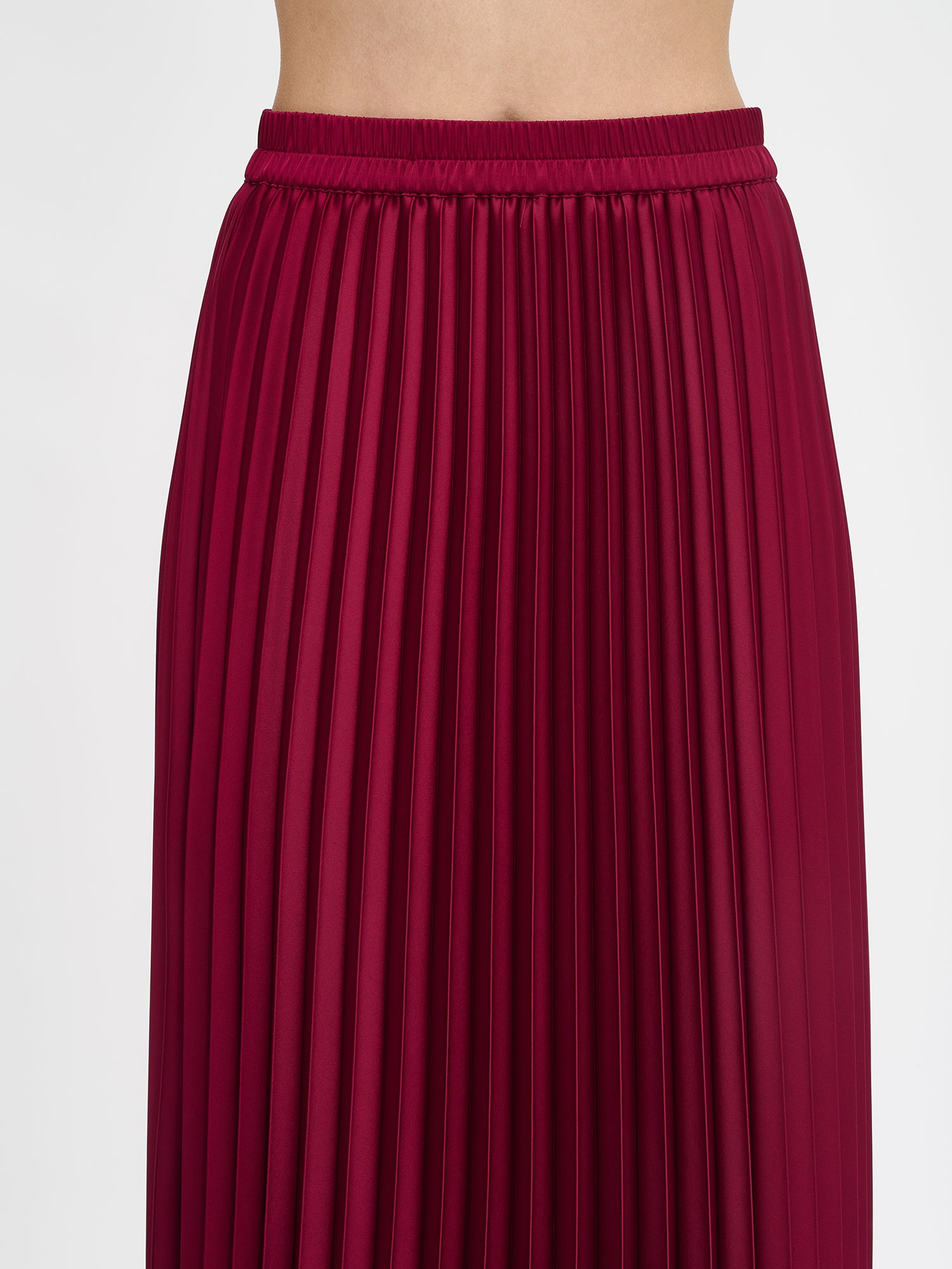 Nanso's elegant Taite skirt for women features a graceful drape in burgundy, close-up
