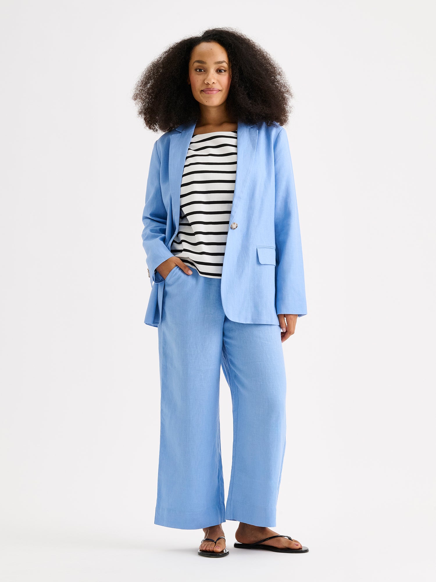 Nanso women's Arles blue blazer on a model with saari culottes in blue.