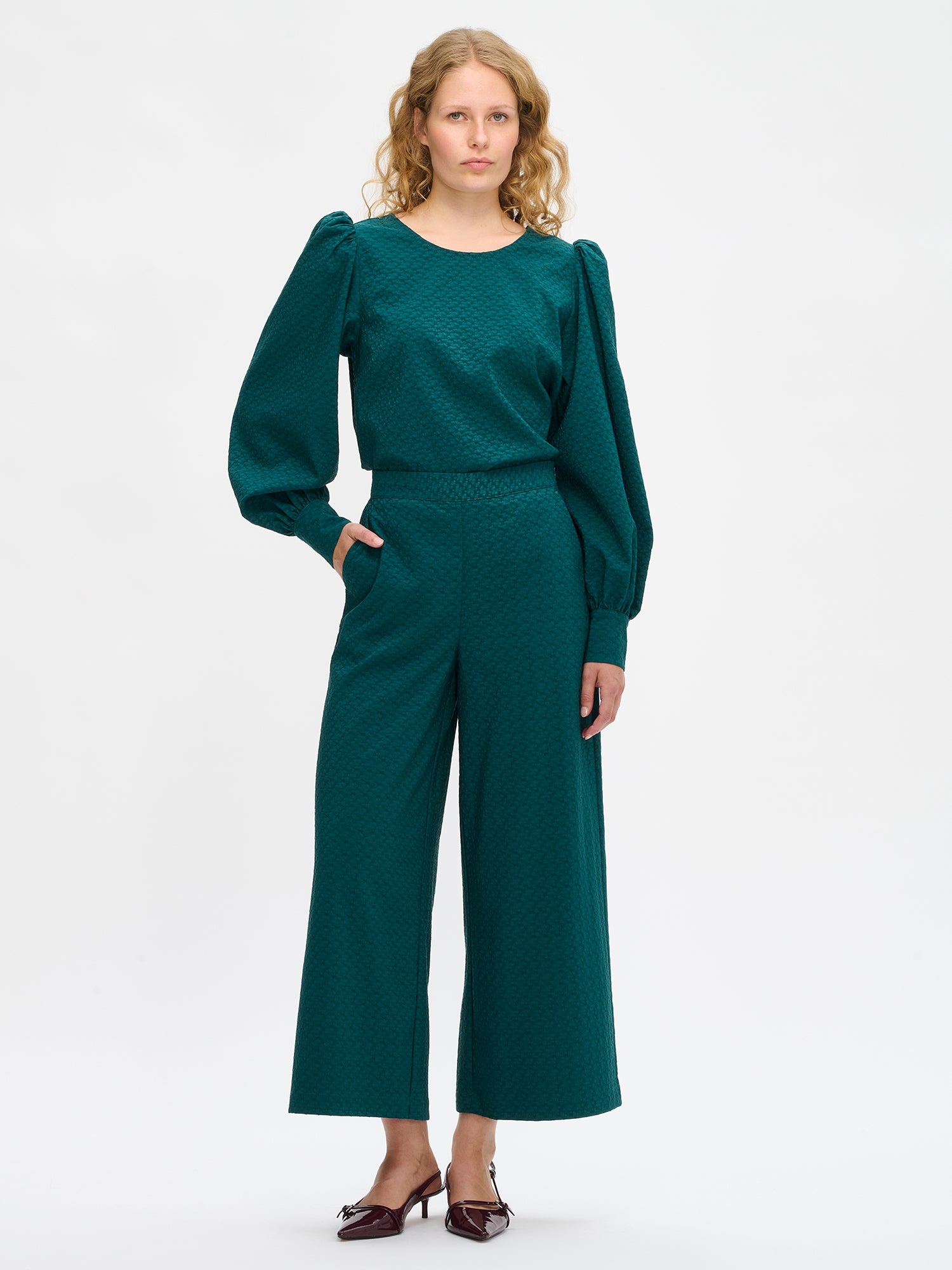 Nanso's stylish women's blouse in dark green features a beautiful textured surface, front