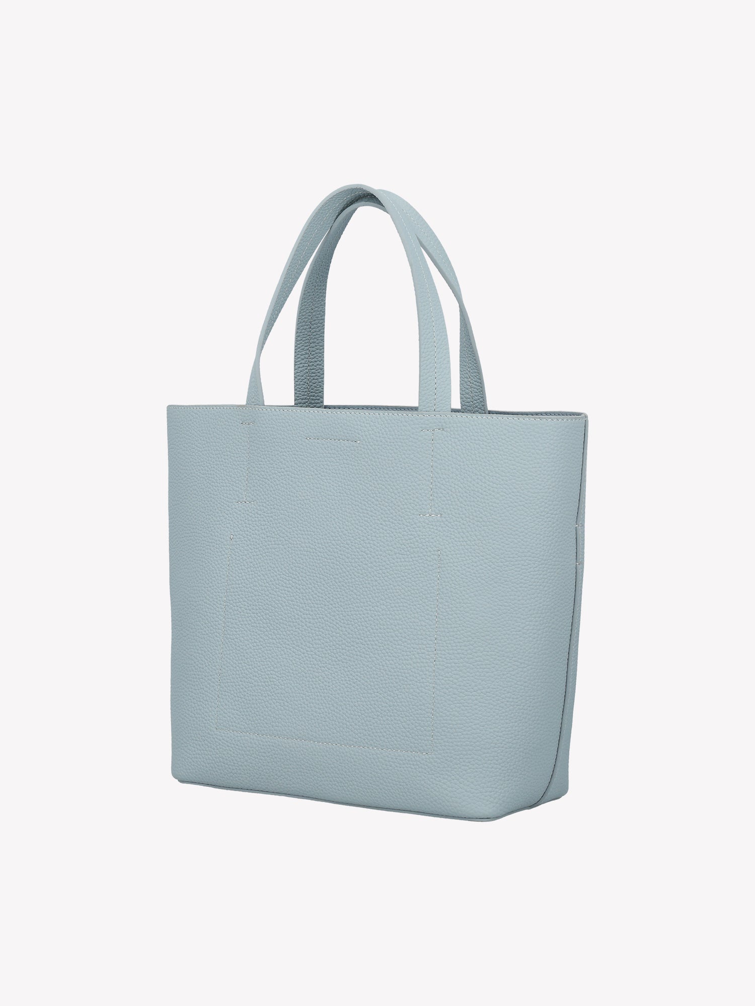 Nanso elegant light blue Naru Tote leather bag. The Naru Tote features both short carry handles and a longer, adjustable and detachable shoulder strap. Product picture from the back without the crossbody strap.