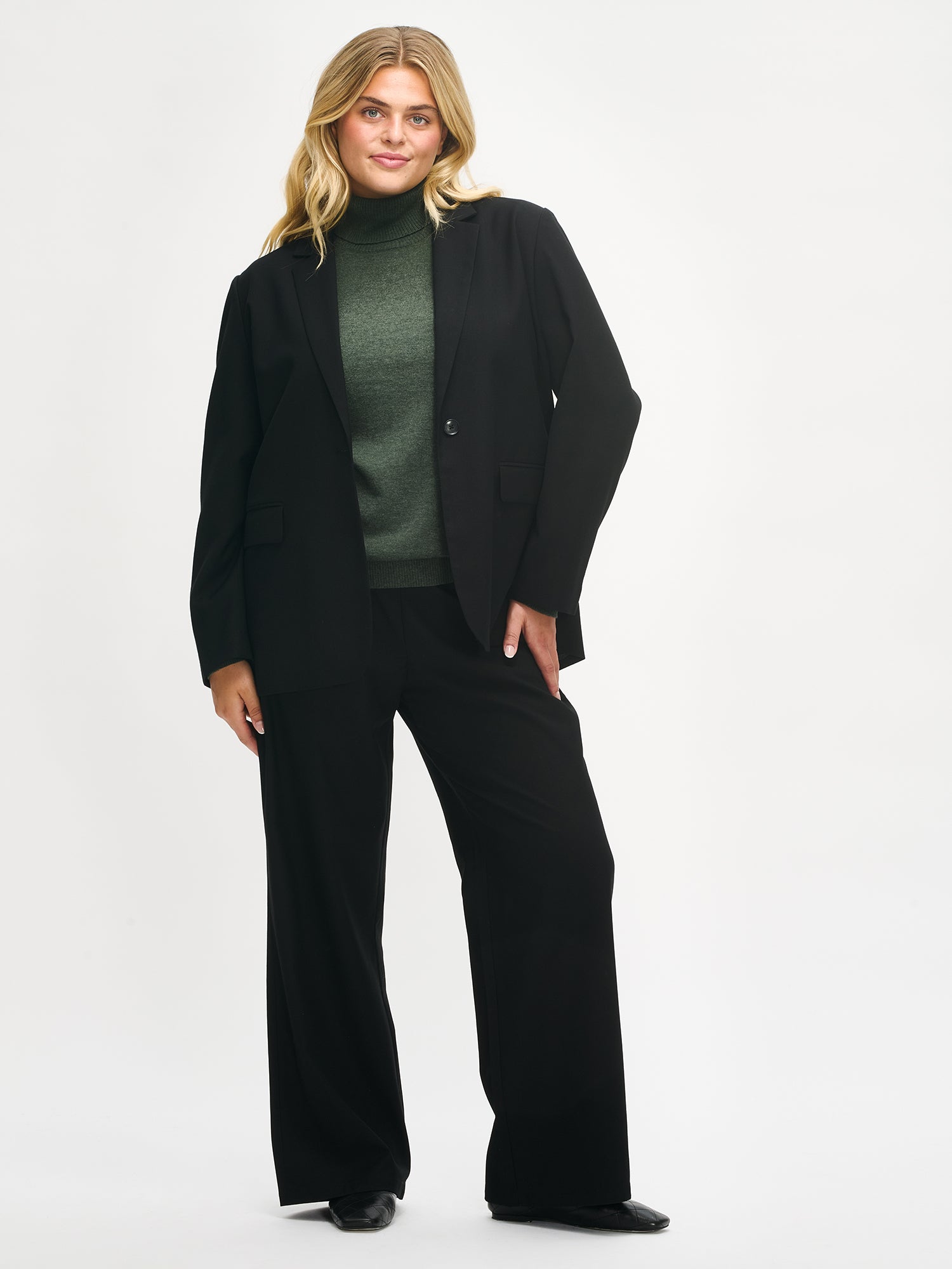 Nanso women's black Bea trousers on a model, front