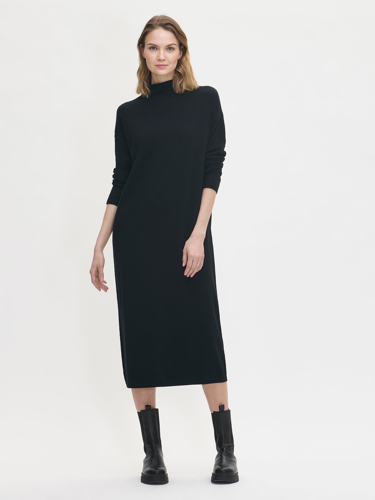 Women's Villis knit dress in black. Worn  by a model in size S.