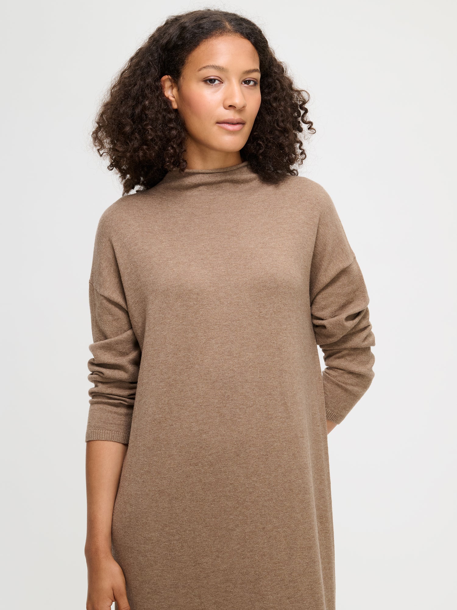 Women's Villis knit dress in grey brown. Worn by a model.