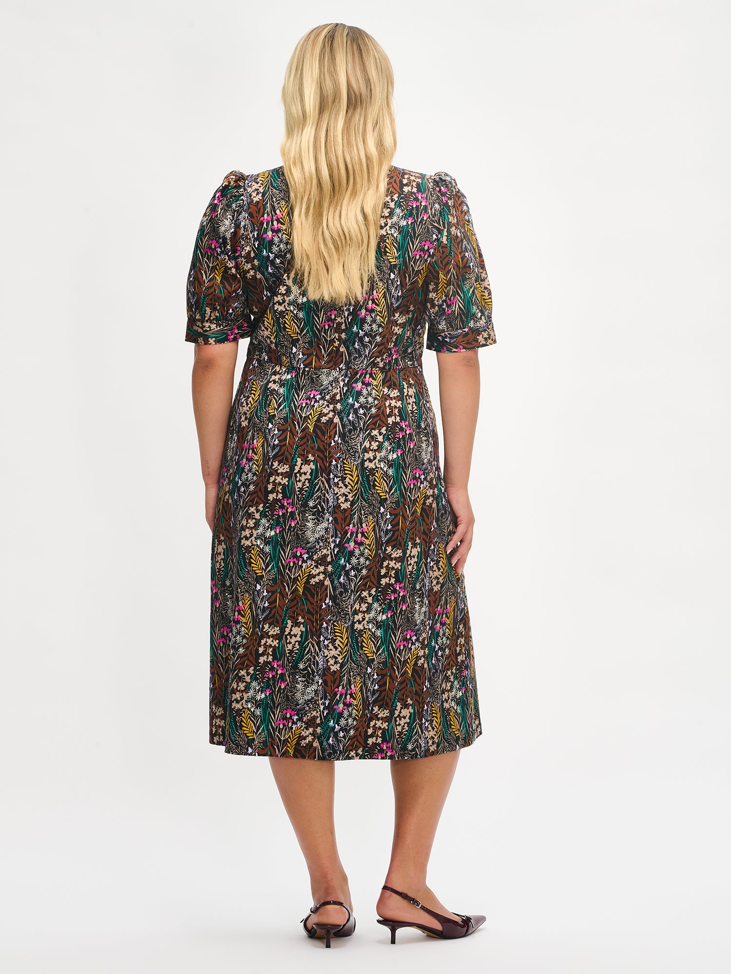 Women´s sophisticated multicolored Kuutamo dress. Worn by a model, from the back.