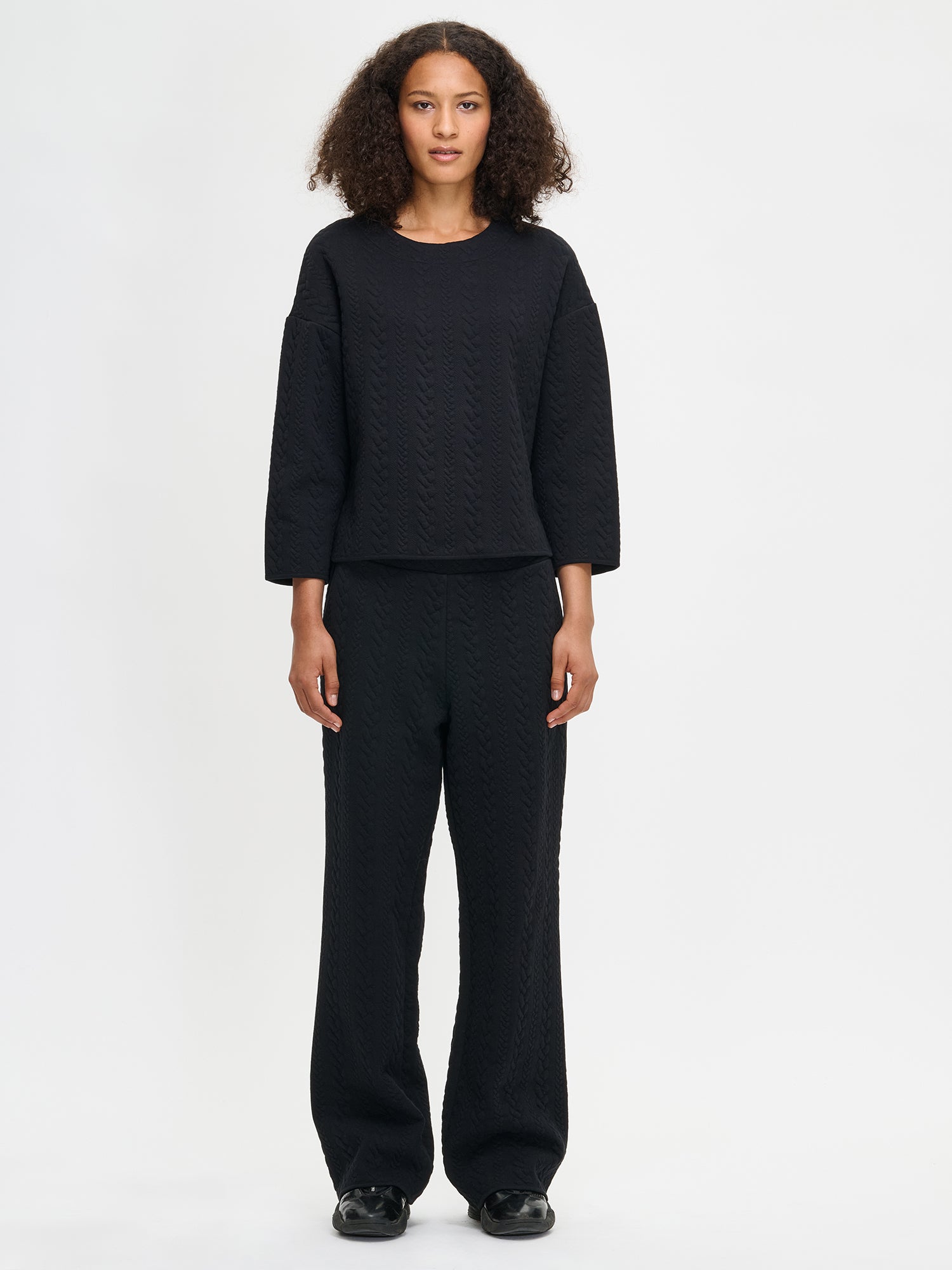 Women´s Letti blouse in black. Worn by a model in size S.