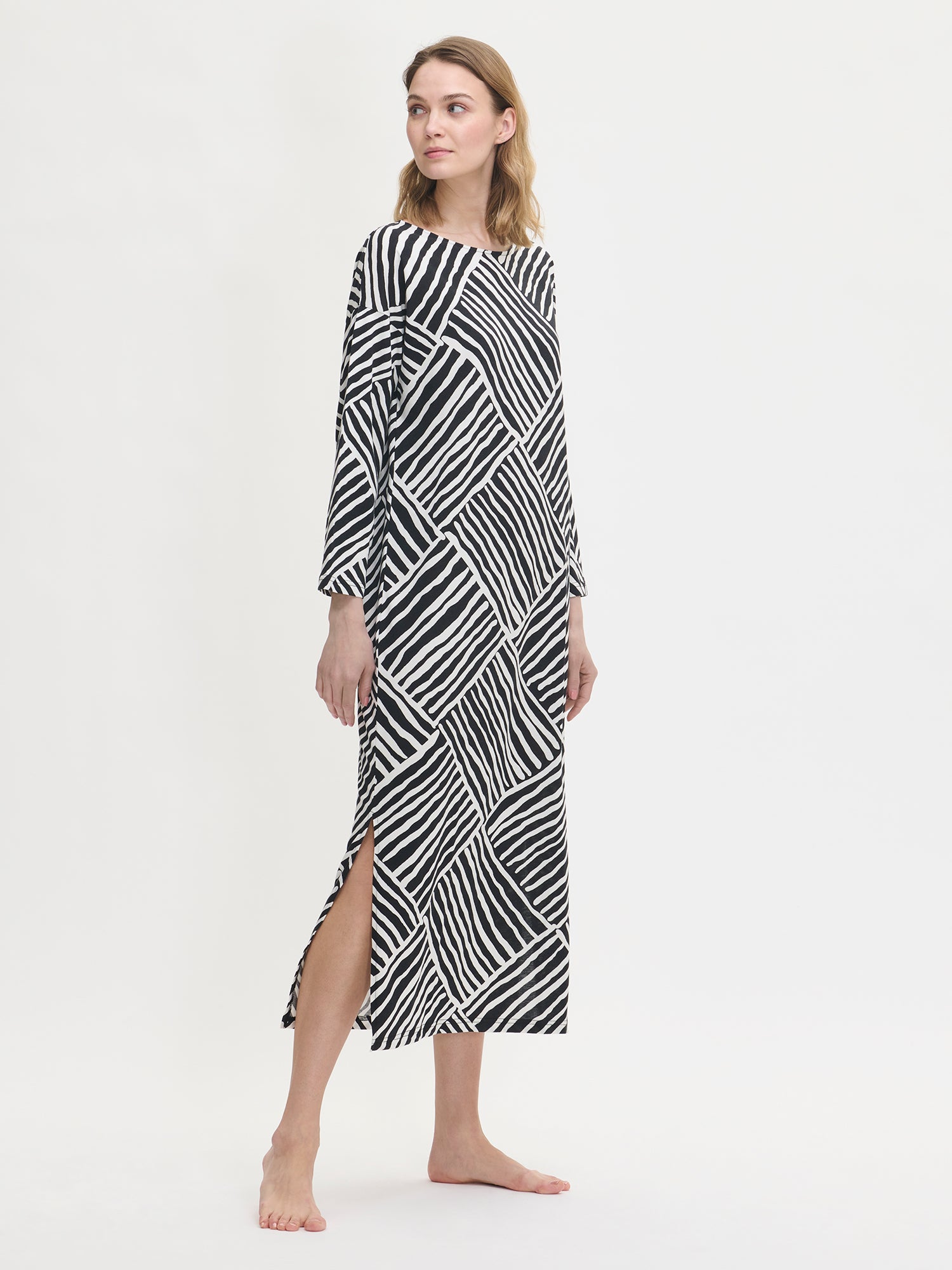 The kaftan features dropped sleeves in full-length and side slits as shown in the picture by the model.