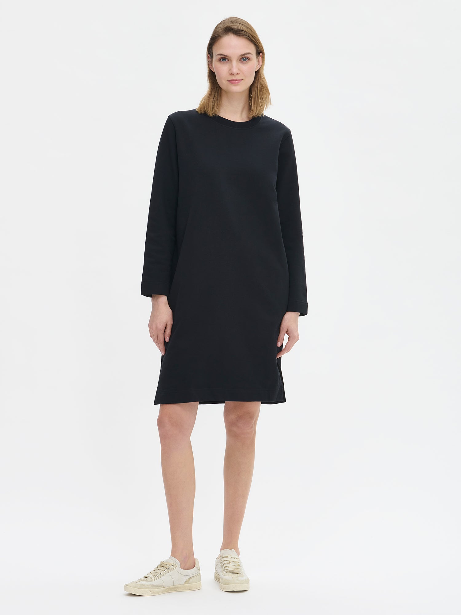 Women's casual Koto dress in black on a model.
