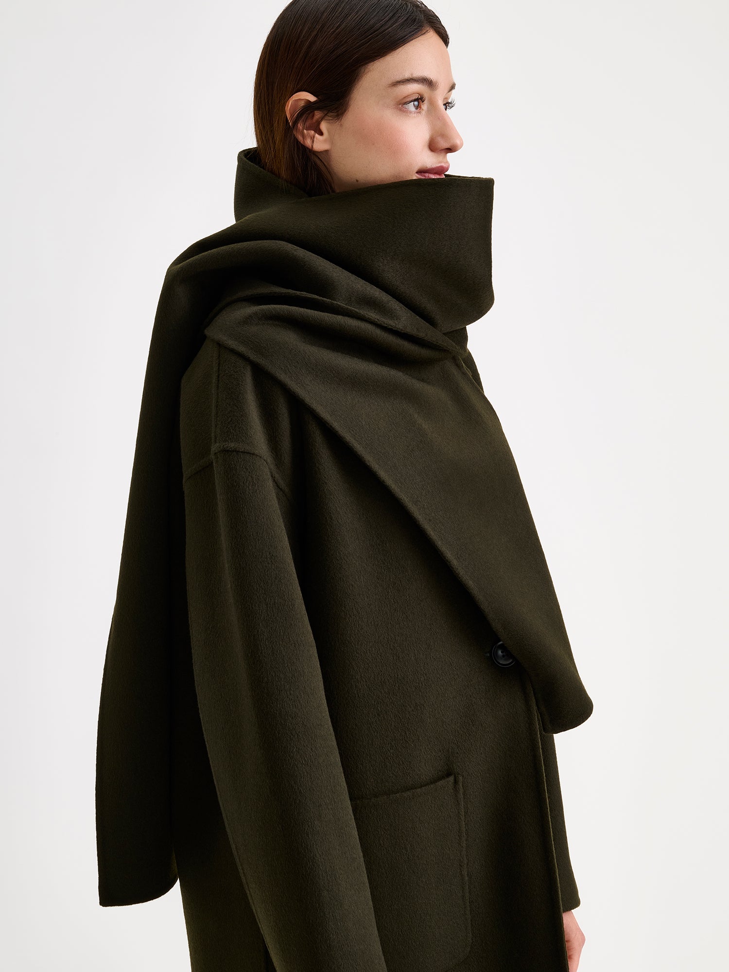 Nanso women's elegant olive green Elli wool scarf on a model