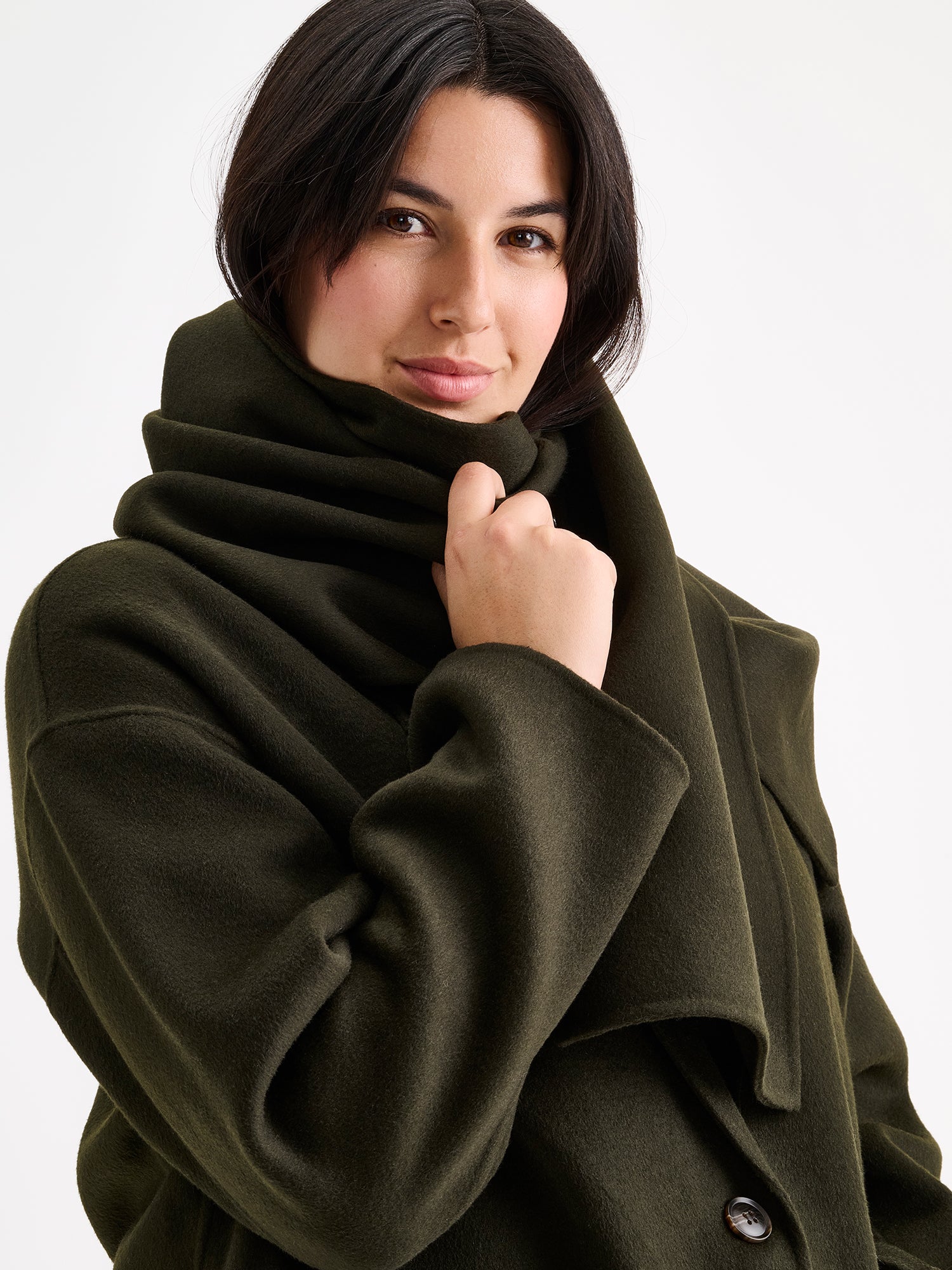 Nanso women's elegant olive green Elli wool scarf on a model