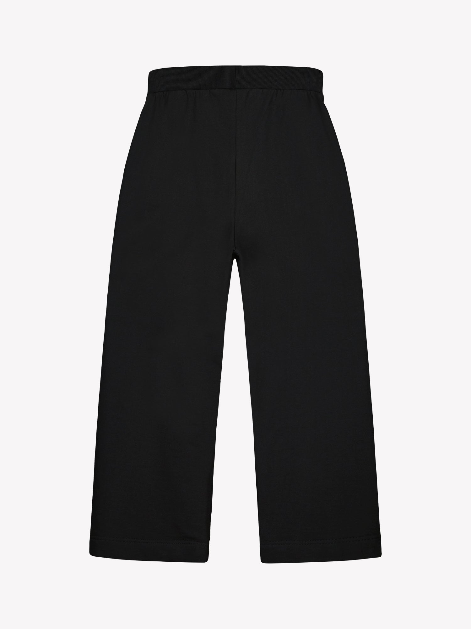 Black Koto pants on a white background from the back in a product picture.