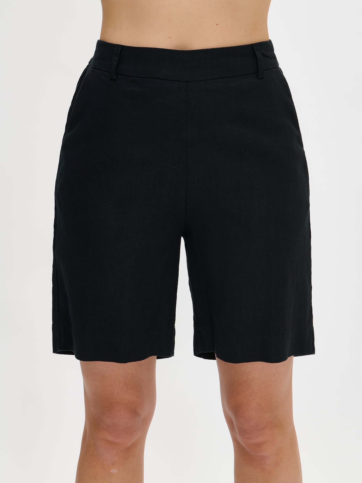 Nanso's classic black Liine linen shorts for women on a model close-up.