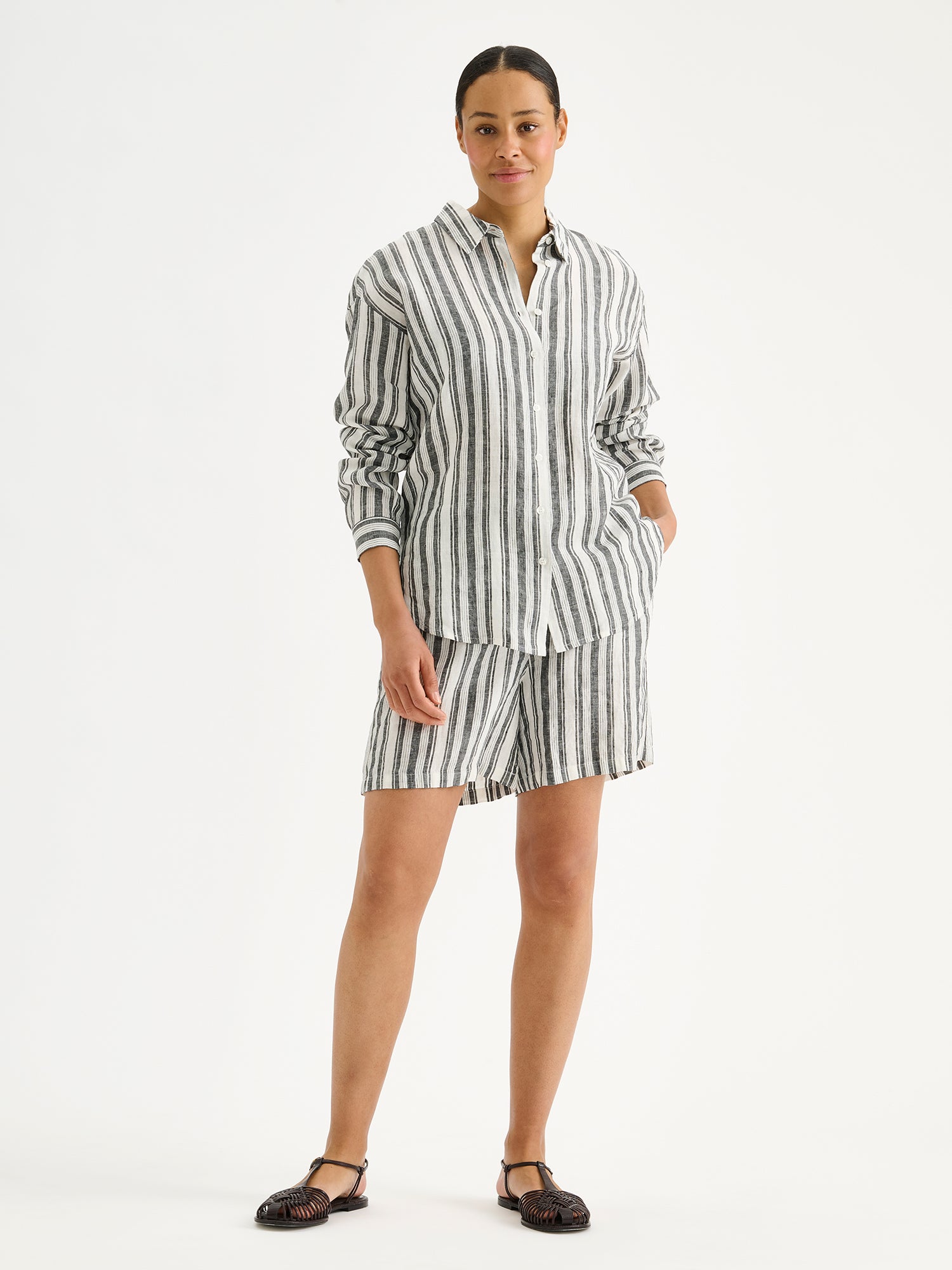 Nanso women's striped black and white Regatta linen shirt on a model with matching shorts