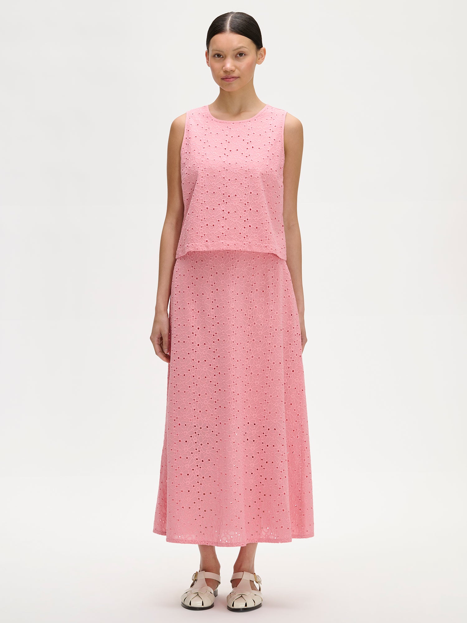 Nanso women's lovely NUPPU Embroidered Blouse in light pink on a model with a matching skirt