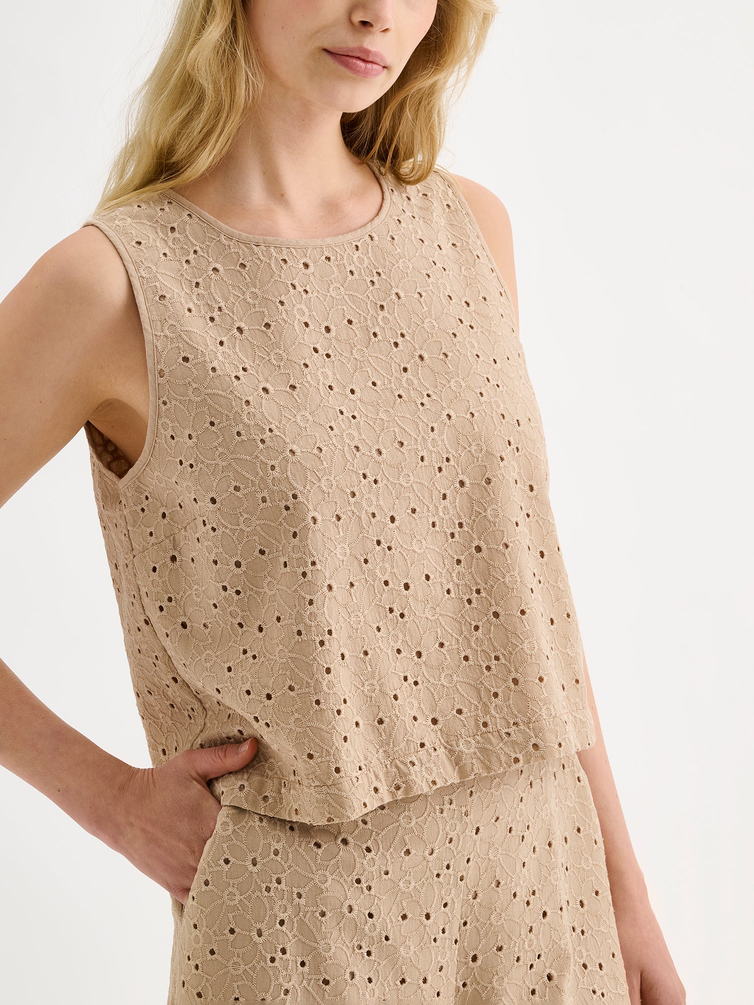 Nanso women's lovely NUPPU Embroidered Blouse in beige on a model with matching trousers, close-up.