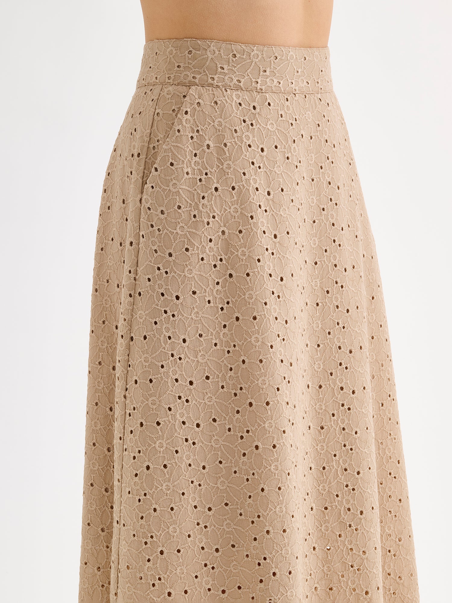 Nanso women's embroidered NUPPU Skirt in beige featuring a broderie anglais style lace fabric, on a model close-up.