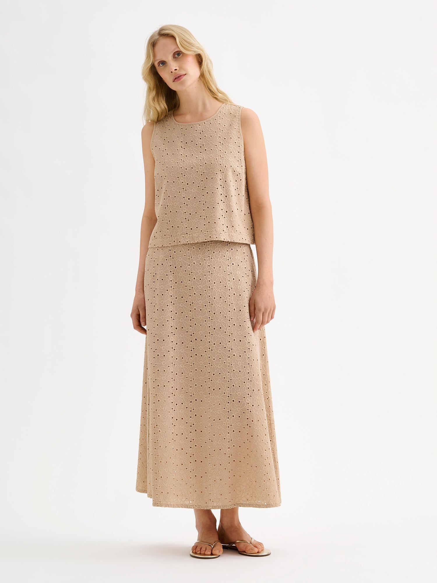 Nanso women's embroidered NUPPU Skirt in beige featuring a broderie anglais style lace fabric, on a model with a matching blouse