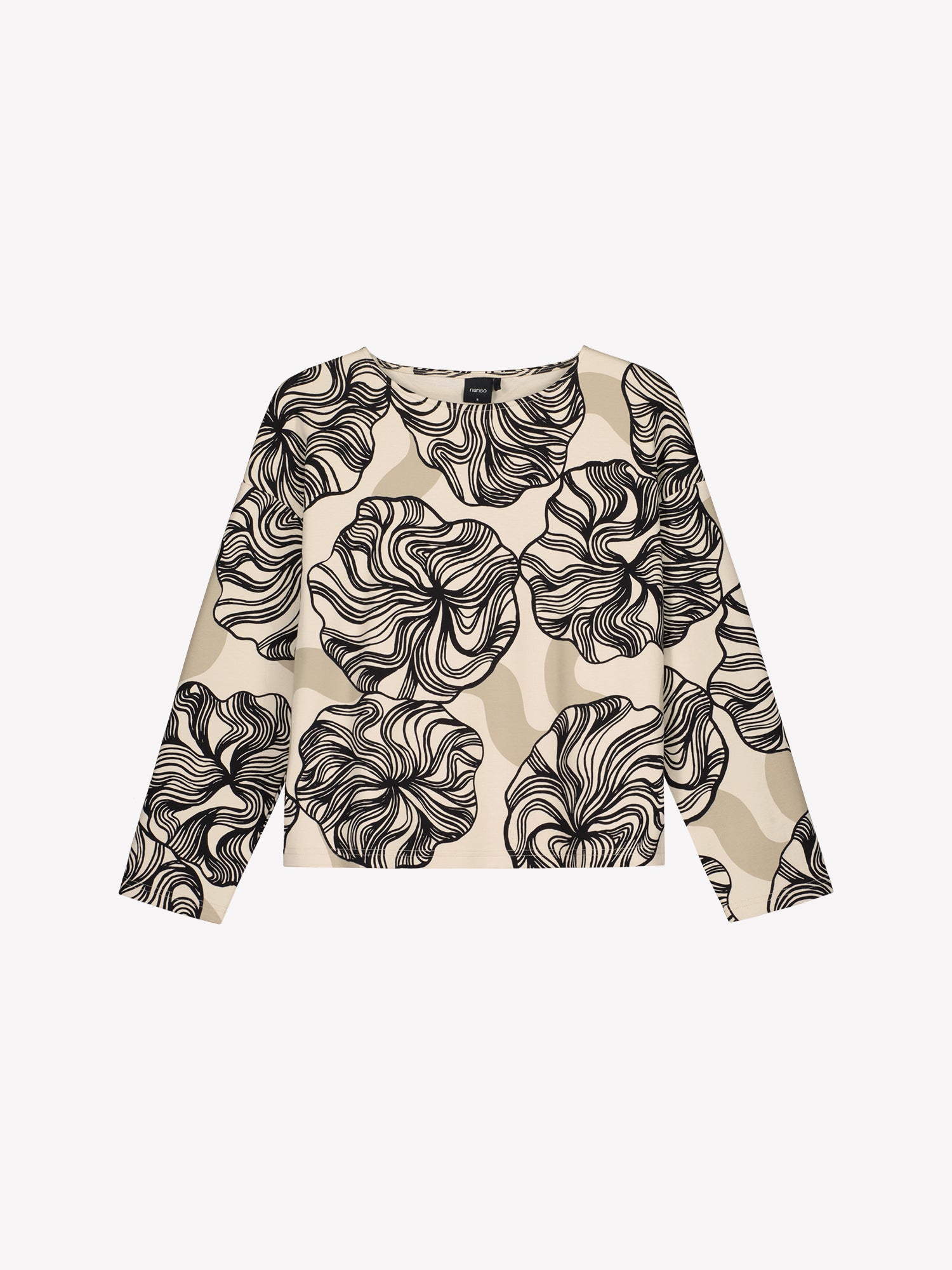 The Kosmo patterned blouse for women with a boat neckline, dropped shoulders, and full-length sleeves and side slits at the hem. Product picture from the front.