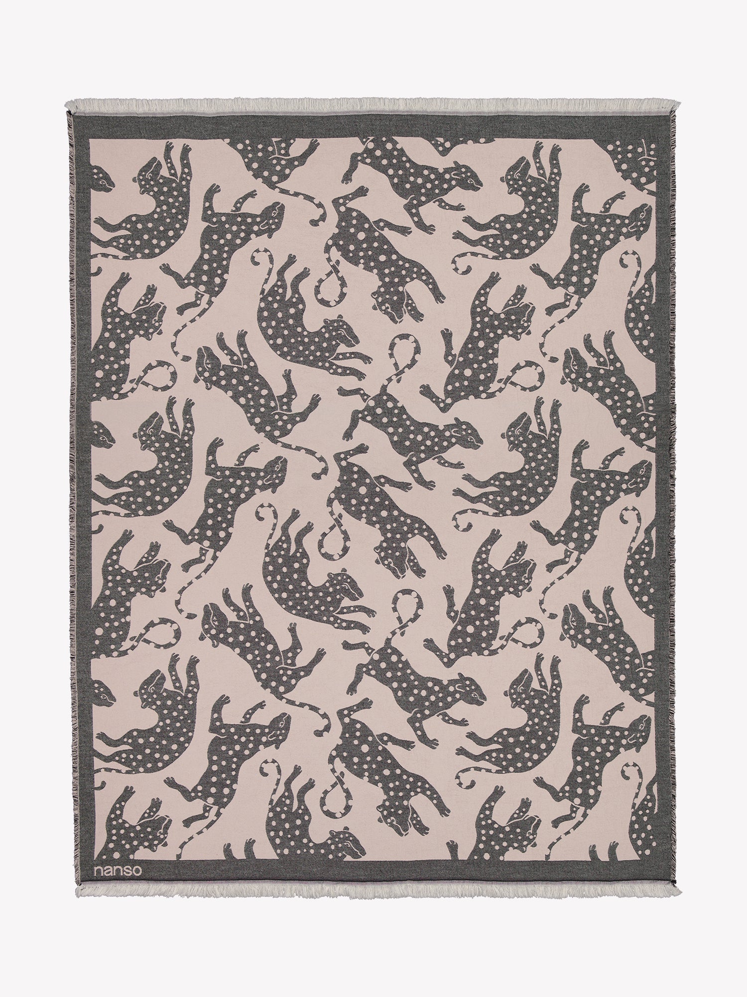 The Leonora blanket in light pink with grey leopards opened in a product picture.