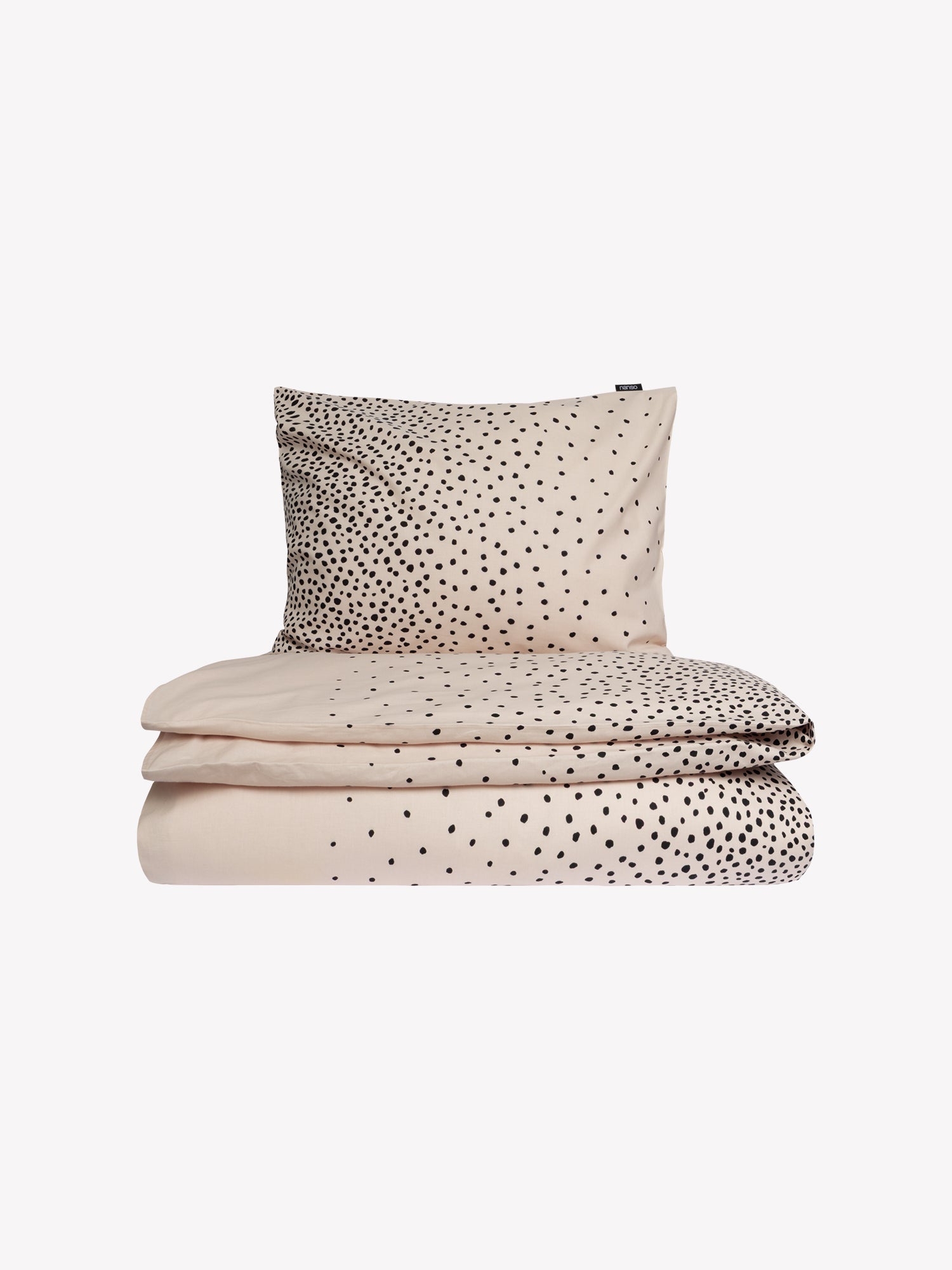 Täplä duvet cover set in a shade of rose with charming black dots closed in a product picture.