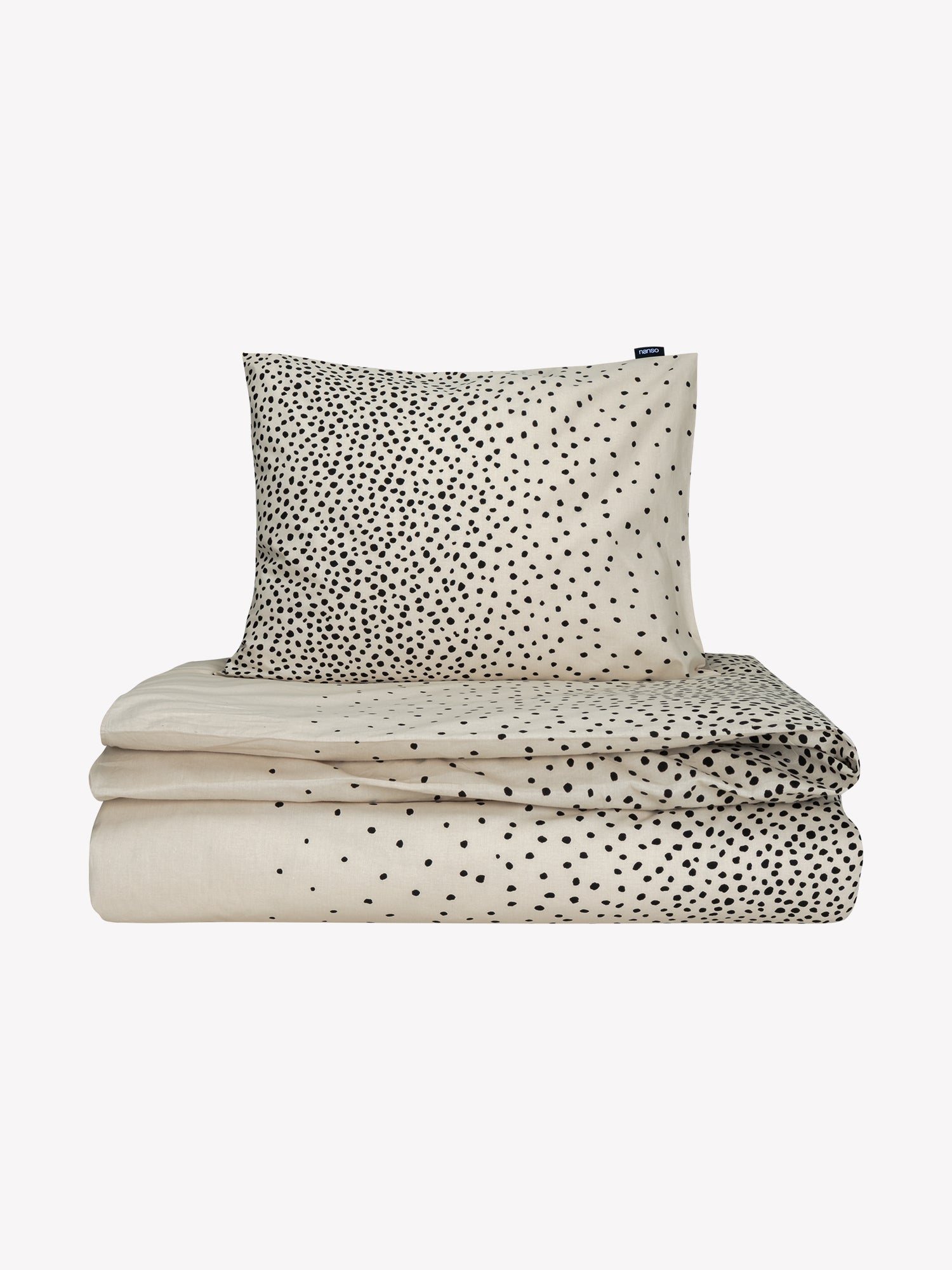 Täplä duvet cover set in beige with charming dots, in a product picture