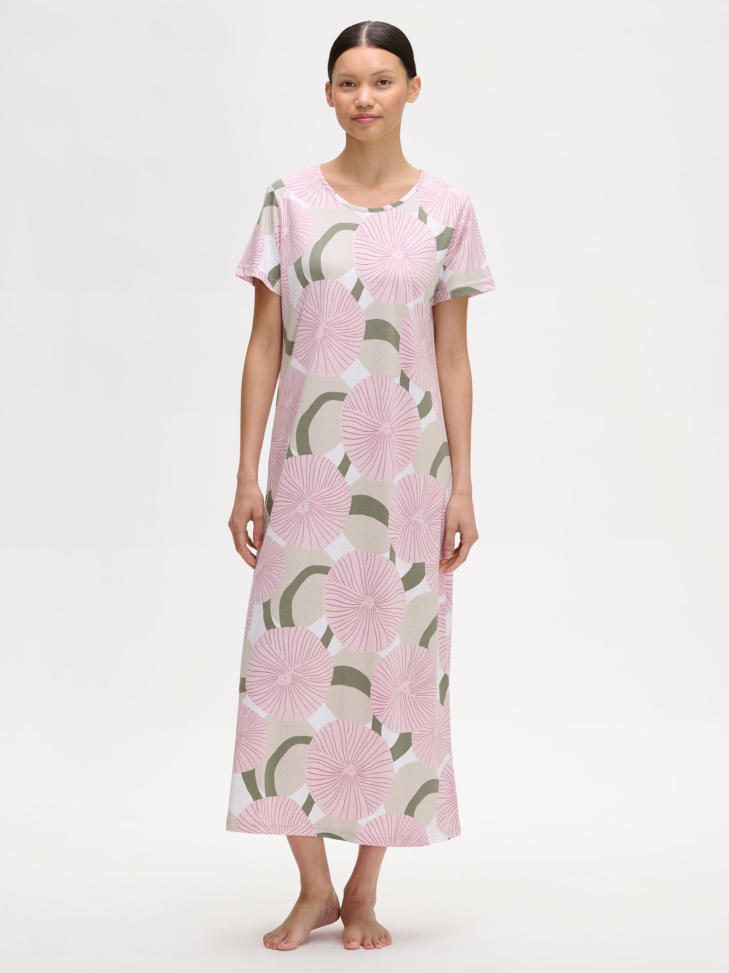 HEDDA Long Nightgown features a delicate pink-toned pattern. Pictured on a model.