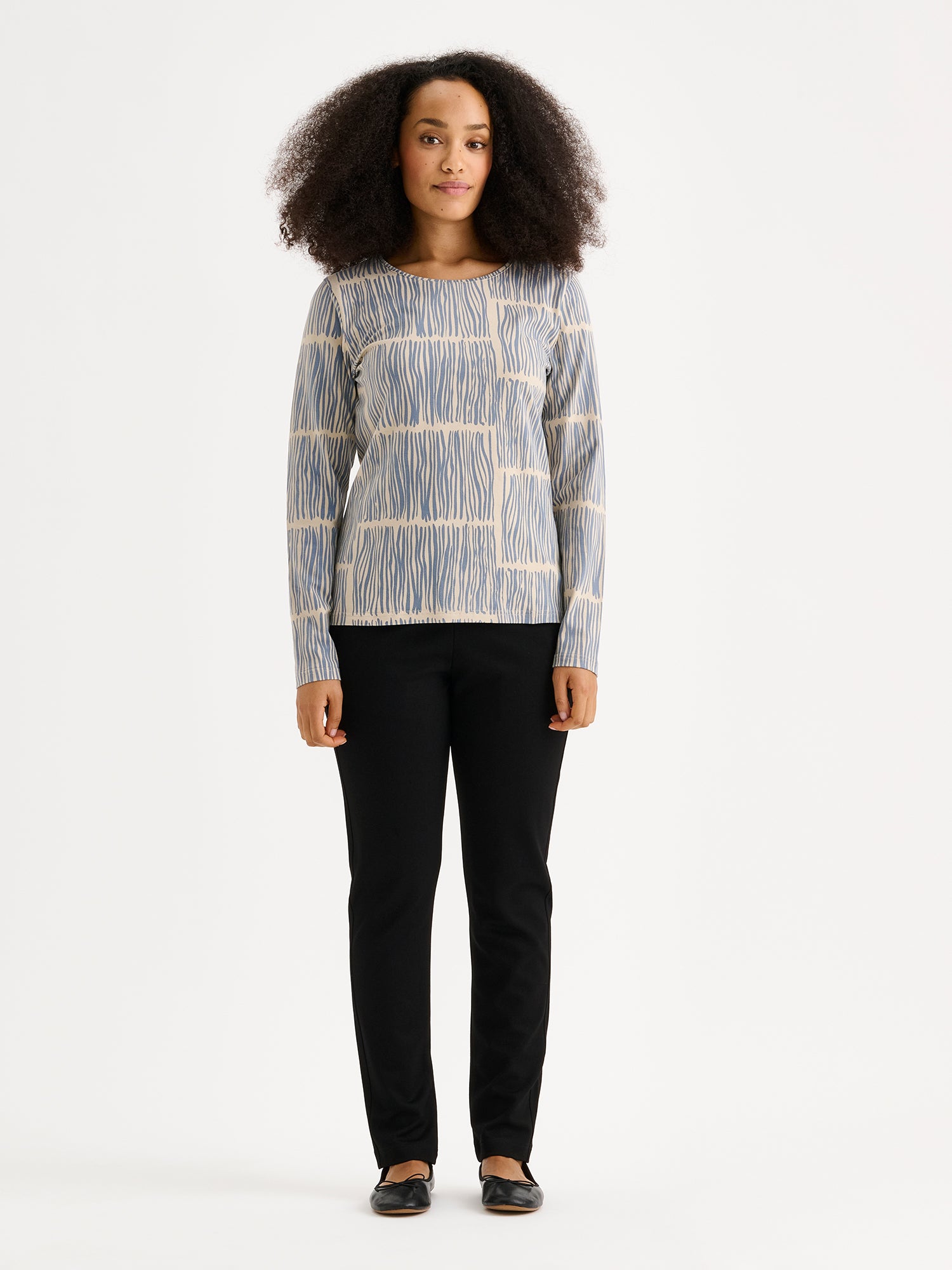 Nanso women's Ruoko jersey blouse on a model with black trousers