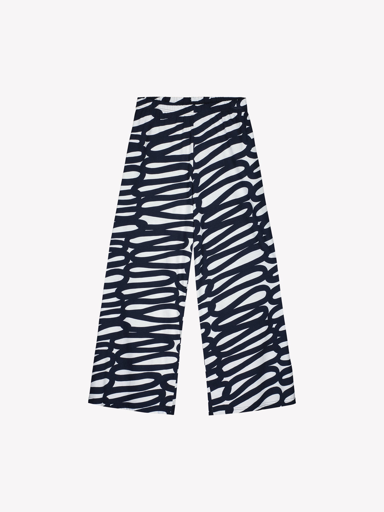 These women's lounge pants feature a striking two-tone pattern that catches the eye, paired with relaxed, wide-leg styling for effortless comfort. Pictured on a model with a white top. Product picture.