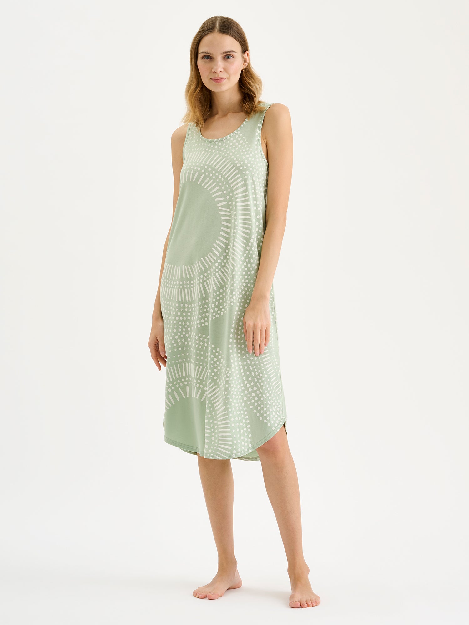 Nanso AURA Long Sleeveless Nightgown in a light green shade and stylish pattern on a blonde model.