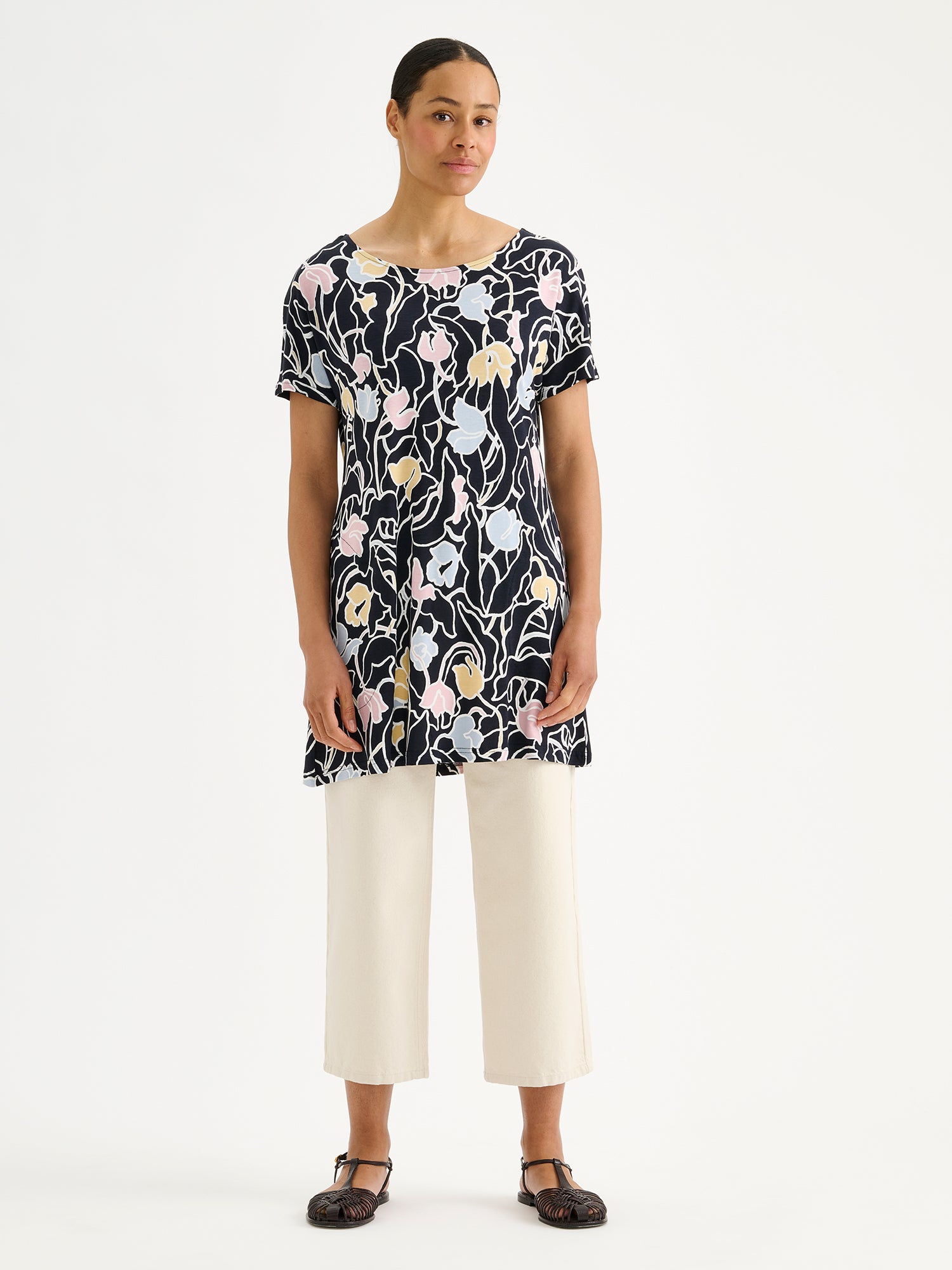 Nanso IIRIS Jersey Tunic - Elegant floral design in soft, breathable viscose jersey on a model with off white jeans