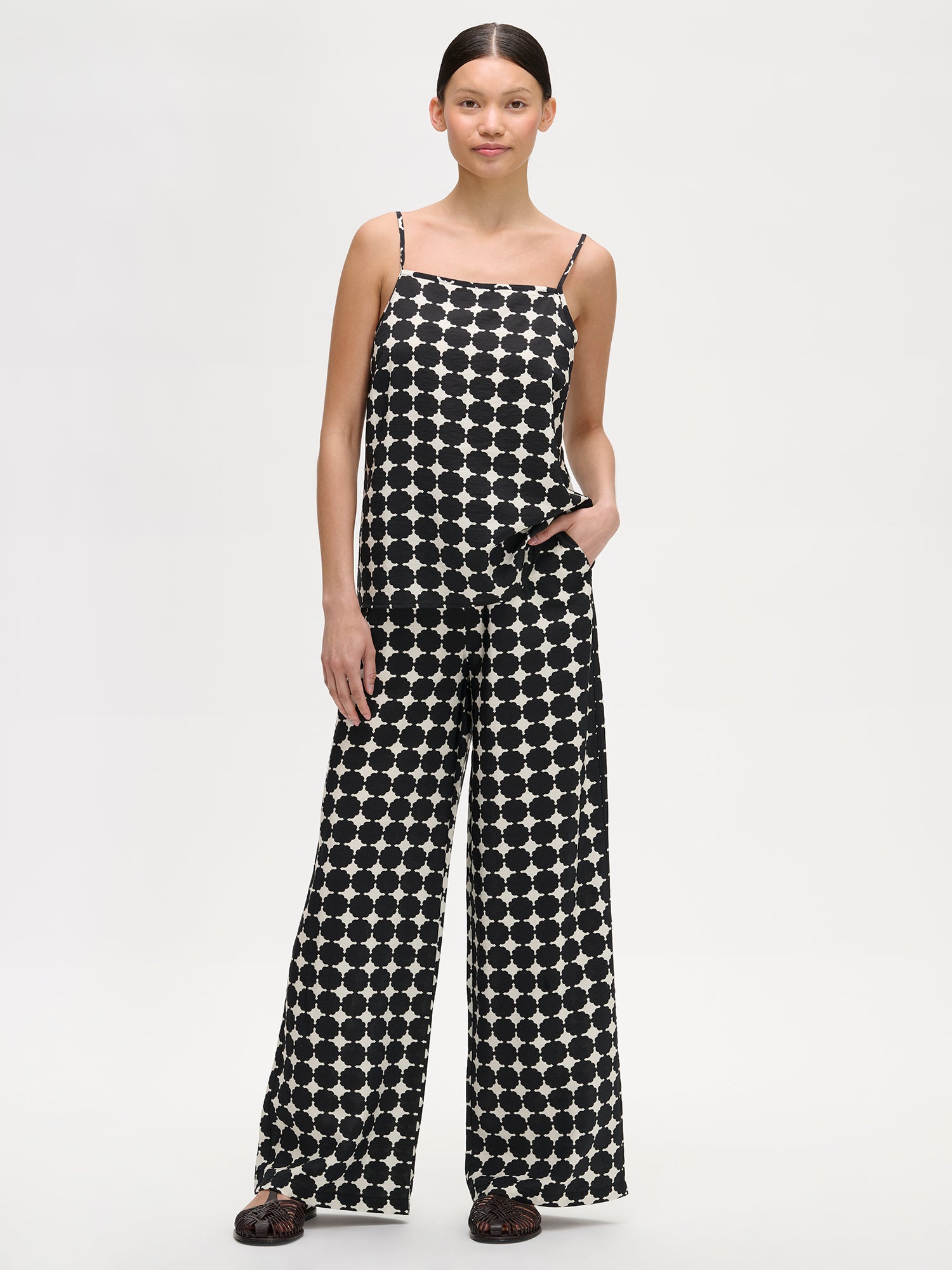Nanso women's wide-leg Avene trousers in a stylish black and white pattern, on a model with a matching top.