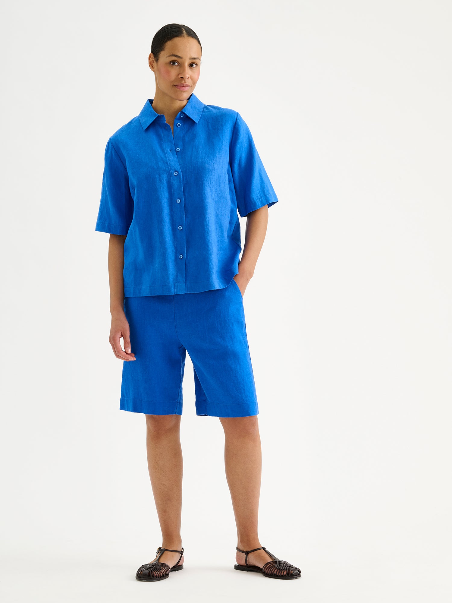 Nanso women's relaxed blue Liine linen shirt, crafted from breathable linen on a model with matching shorts