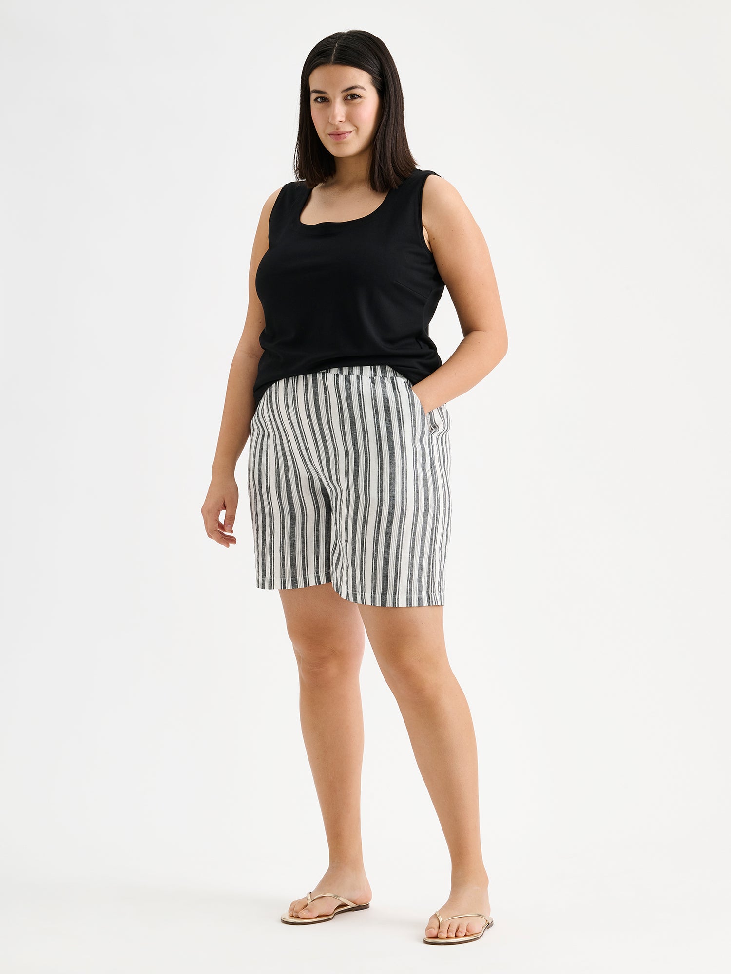 Nanso women's stylish and comfortable REGATTA linen shorts in black and white stripes on a model with a black top.