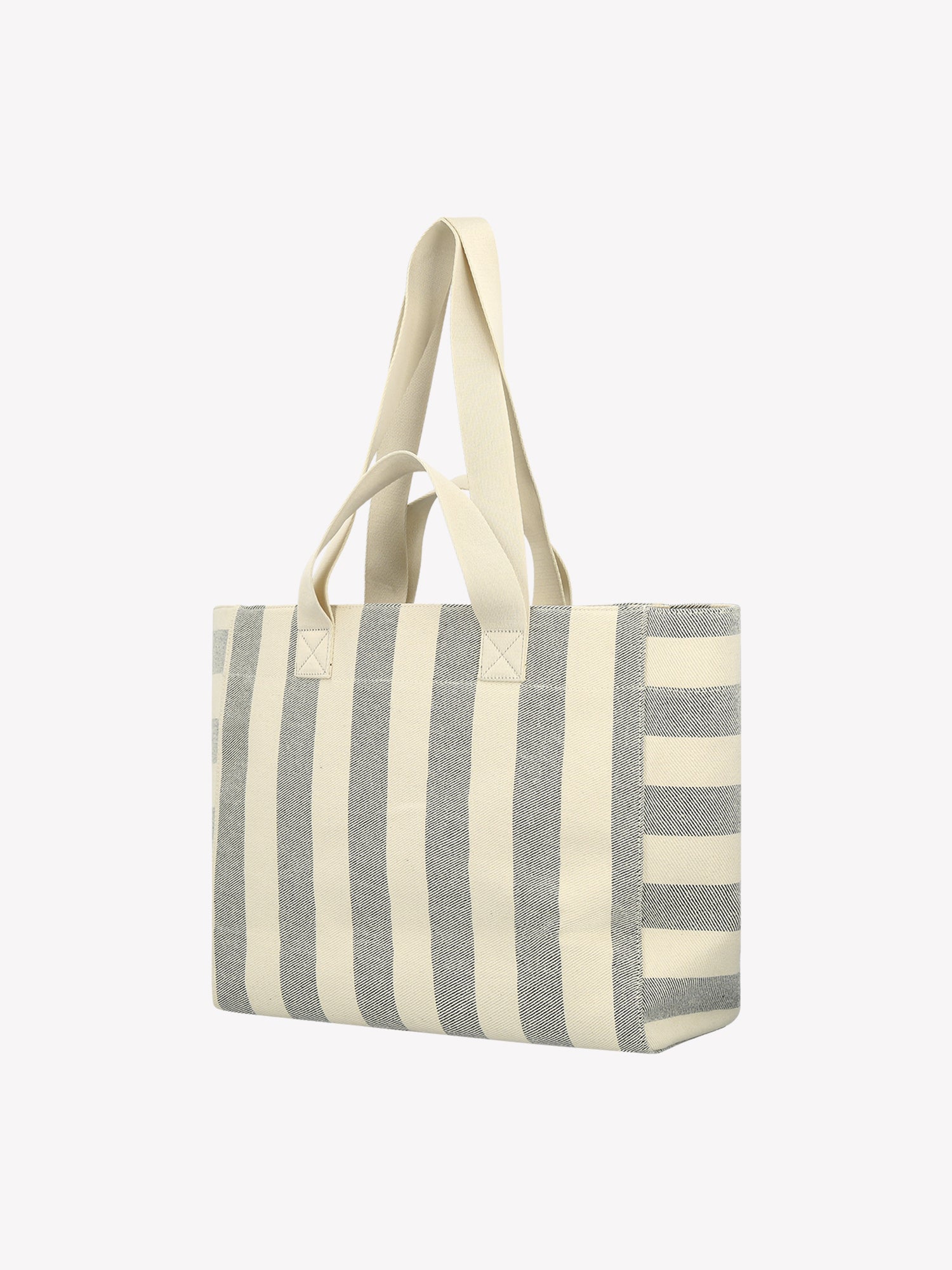 The Amalfi Beach bag brings effortless style to your adventures with its crisp black and white striped design. Product picture from the backside
