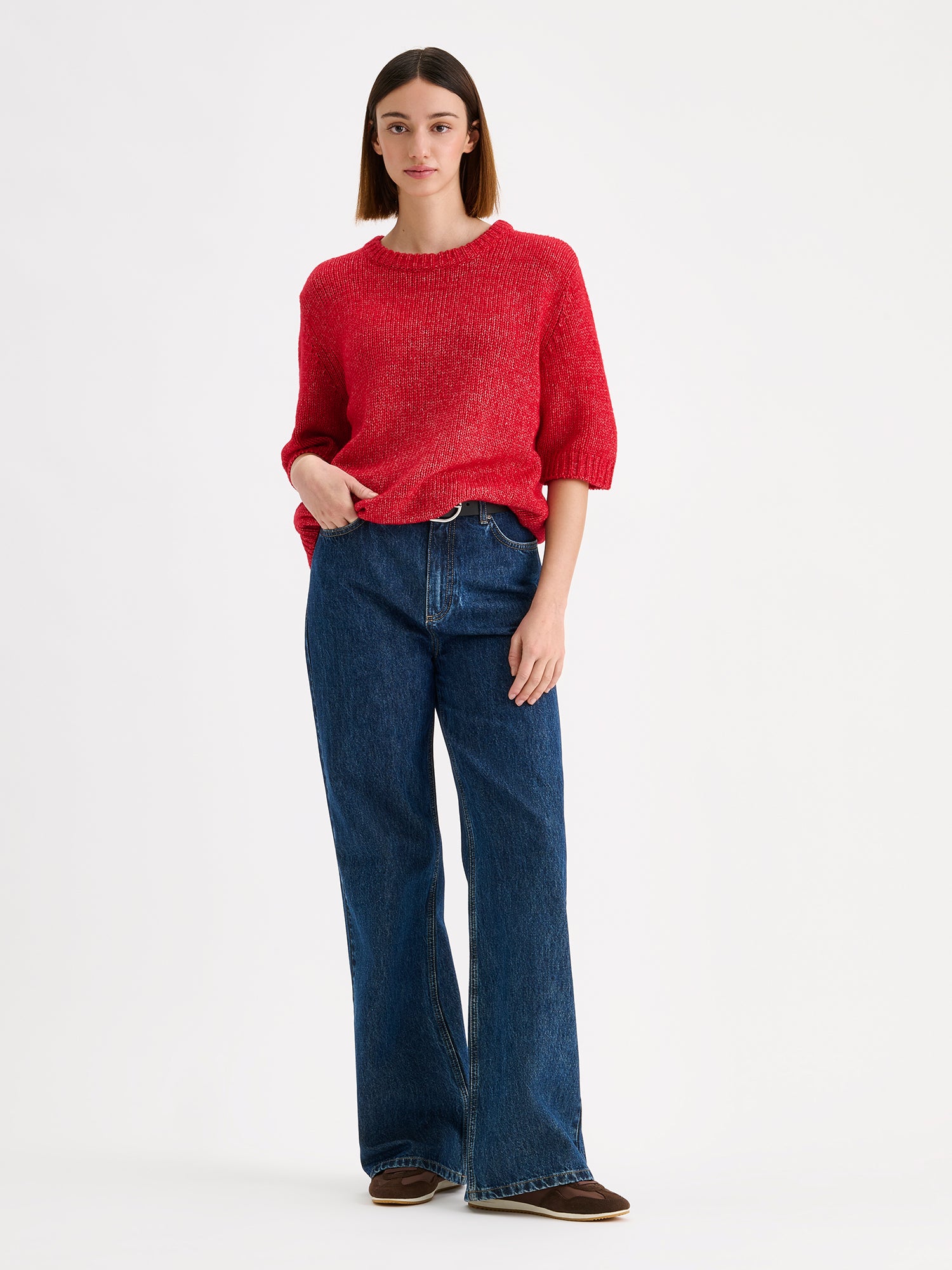 Nanso womens knit sweater Moriko in vibrant red, on a model with blue jeans
