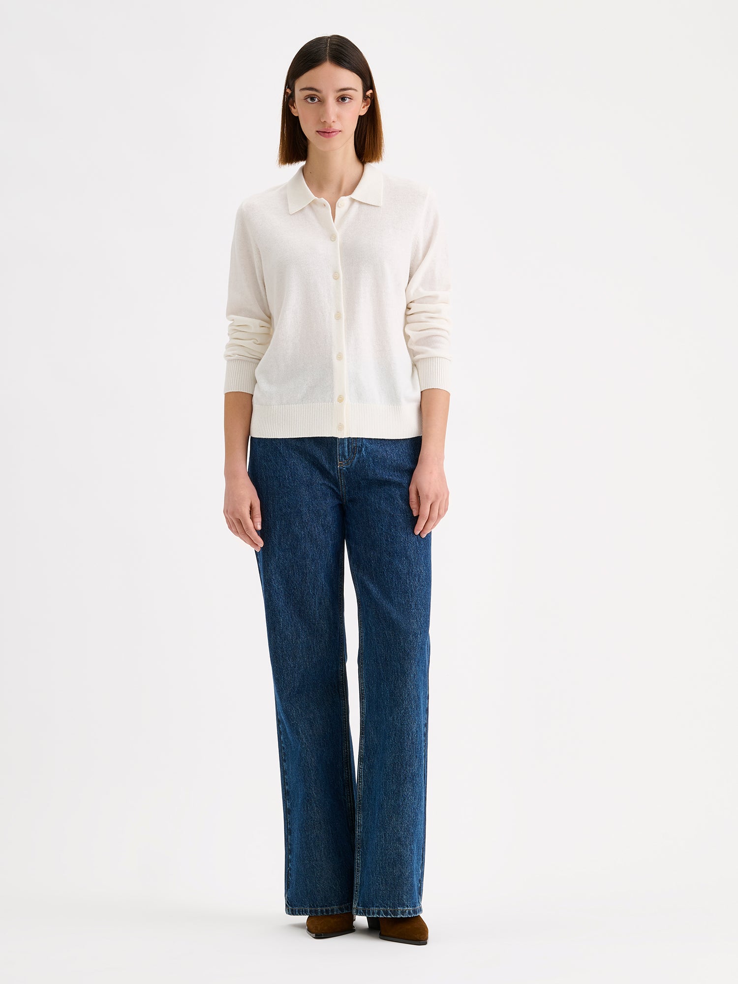 Nanso women's timeless natural white collared Villis cardigan on a model with blue jeans