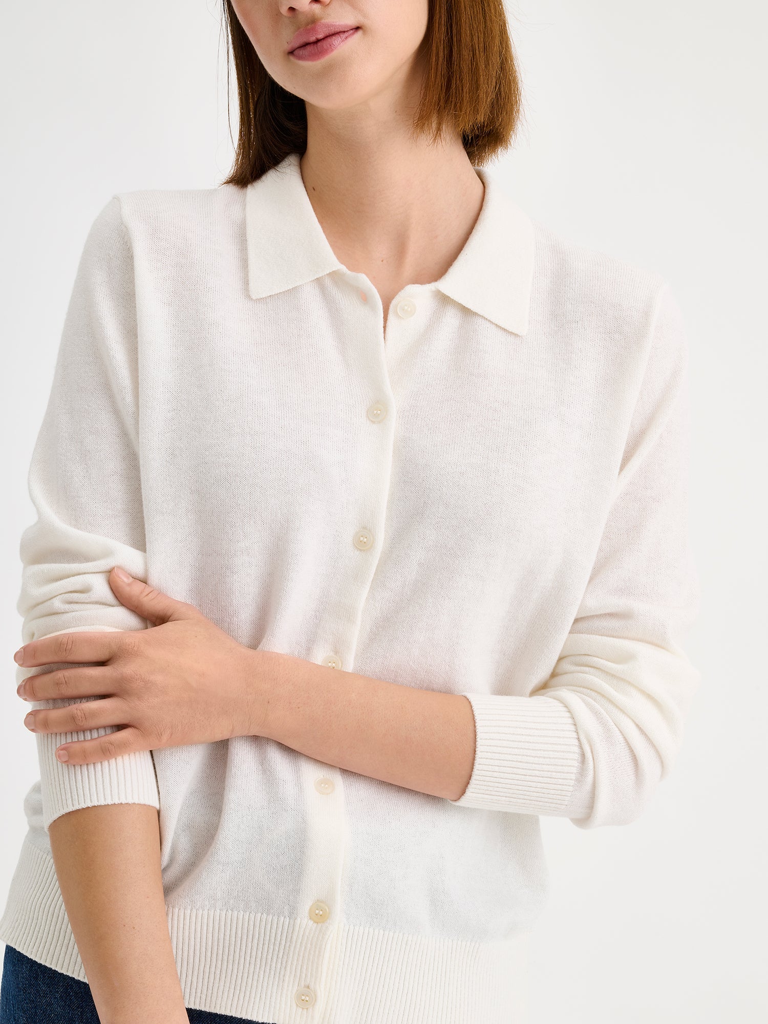Nanso women's timeless natural white collared Villis cardigan on a model with blue jeans