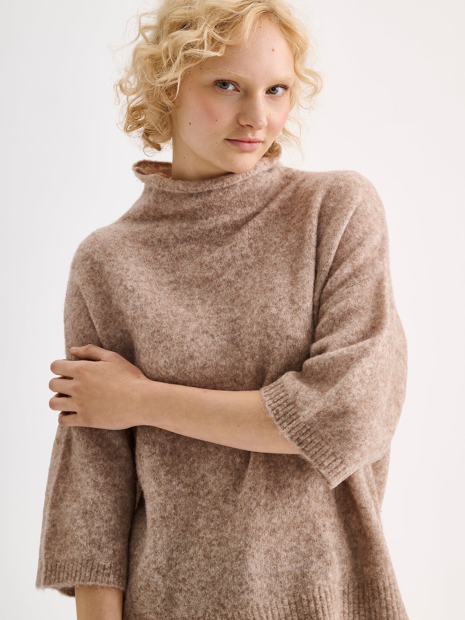 Nanso women's relaxed Alina knit sweater with a high neckline on a model | S - 177cm
