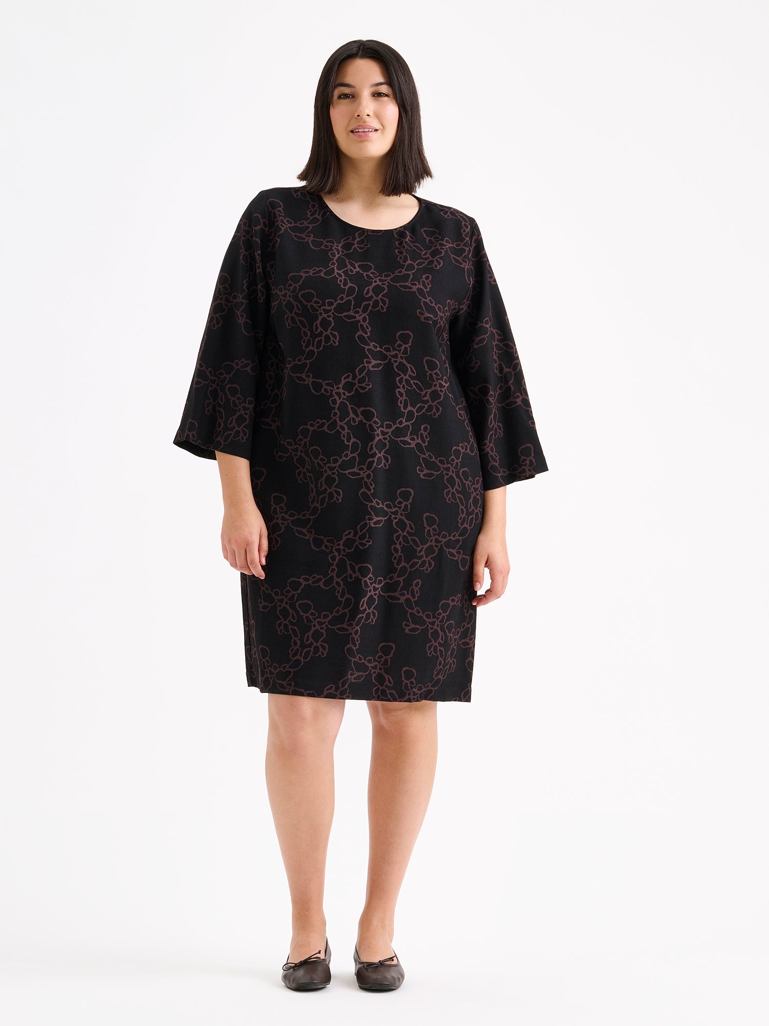 Nanso womens straight-cut woven dress for women featuring a harmonious and elegant black-brown pattern on a model with ballerinas