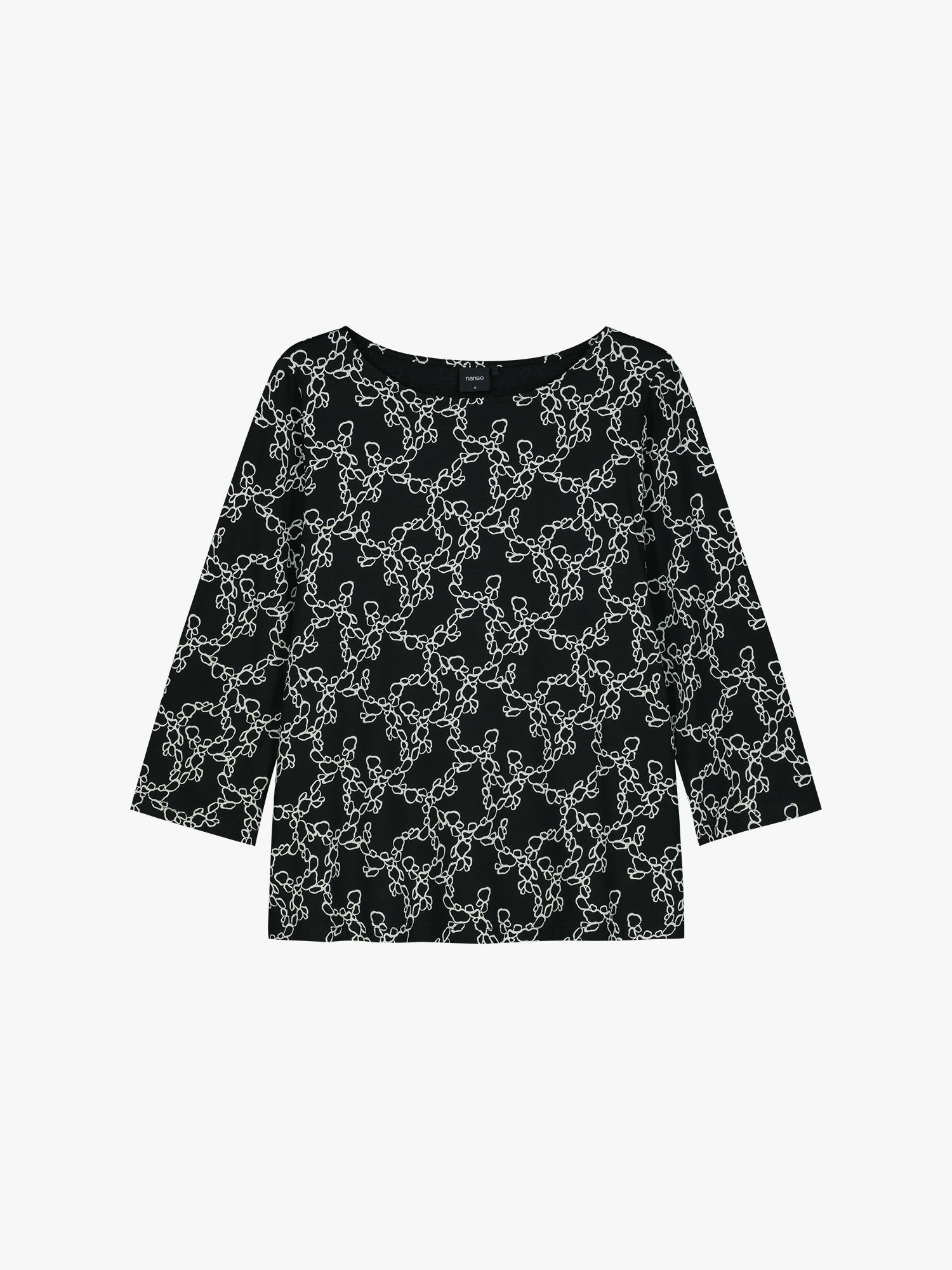 Women's patterned black and white Pieni Kide jersey blouse in a product picture