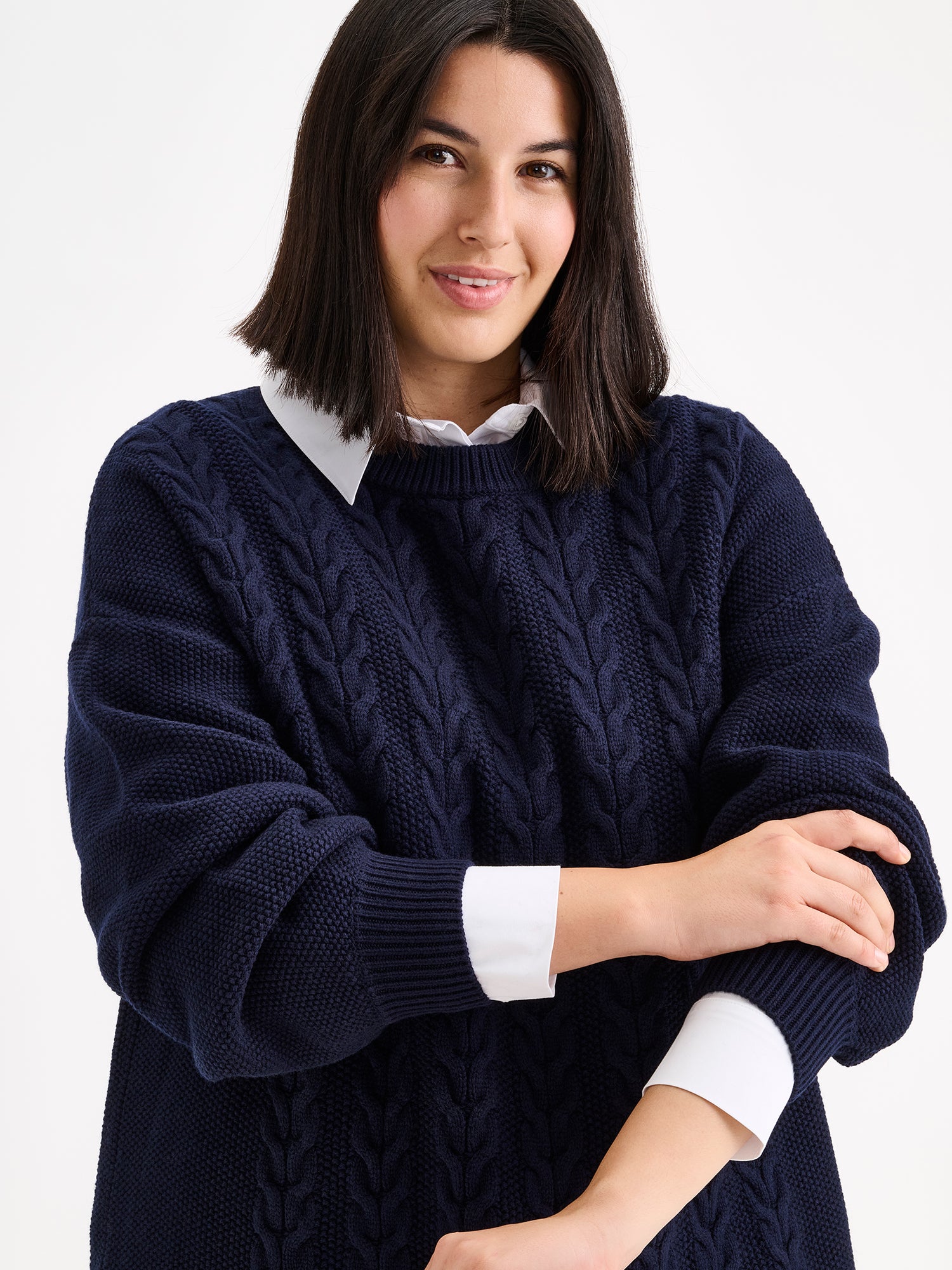 Nanso women's generous dark blue Palmikot knit dress on a model close-up