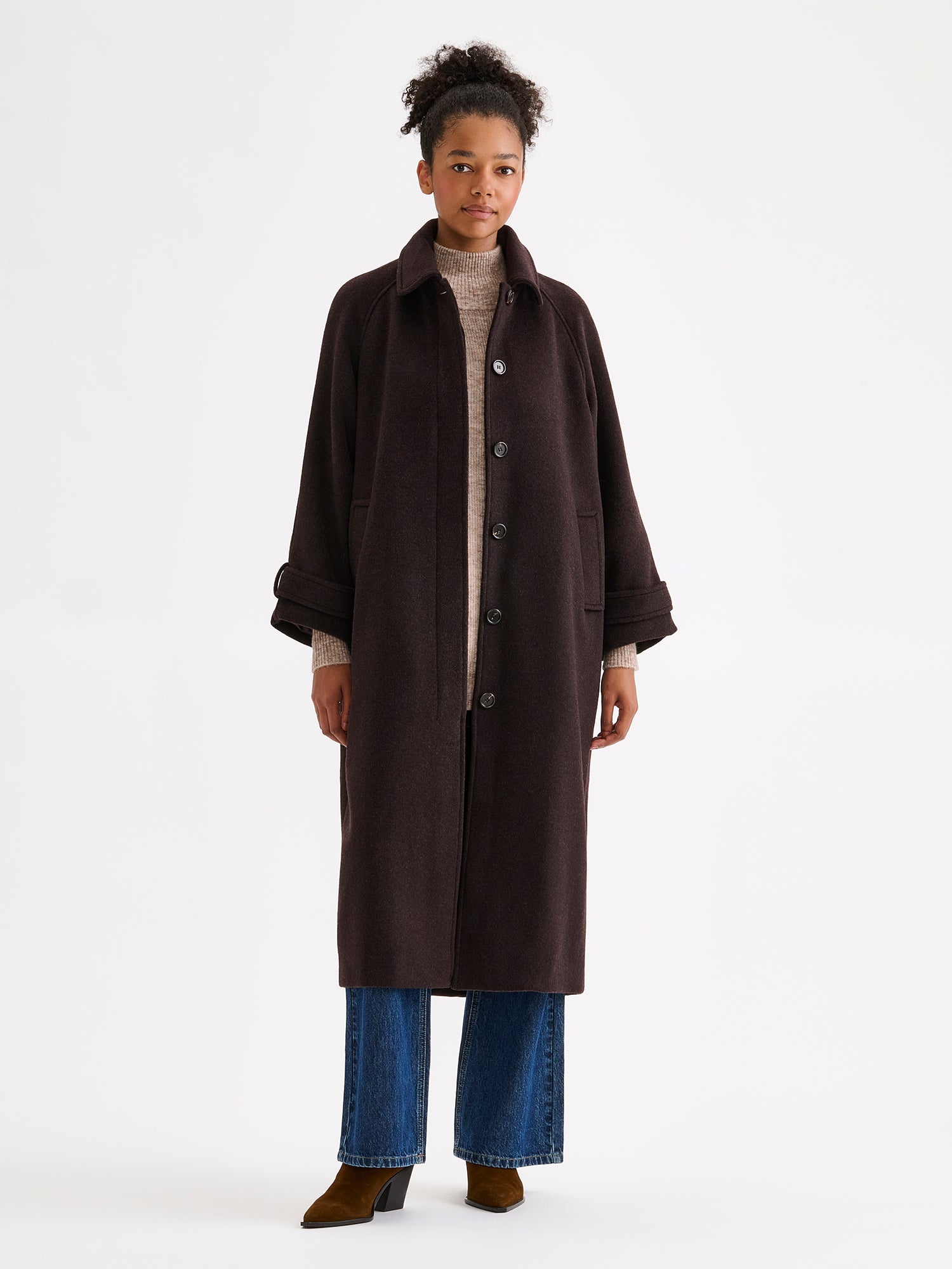 Nanso women's timelessly elegant and effortlessly classic, the Tove long wool coat, on a model with blue jeans