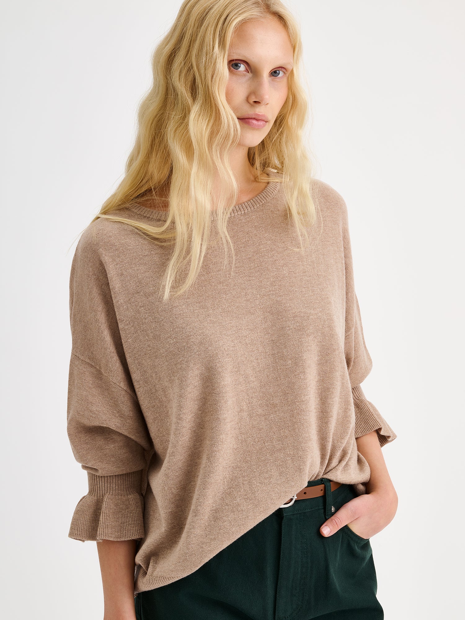Nanso women's simply stylish and lightweight Villis Frilla knit jumper is charmingly finished with beautiful frill details at the cuffs, pictured on a model close-up