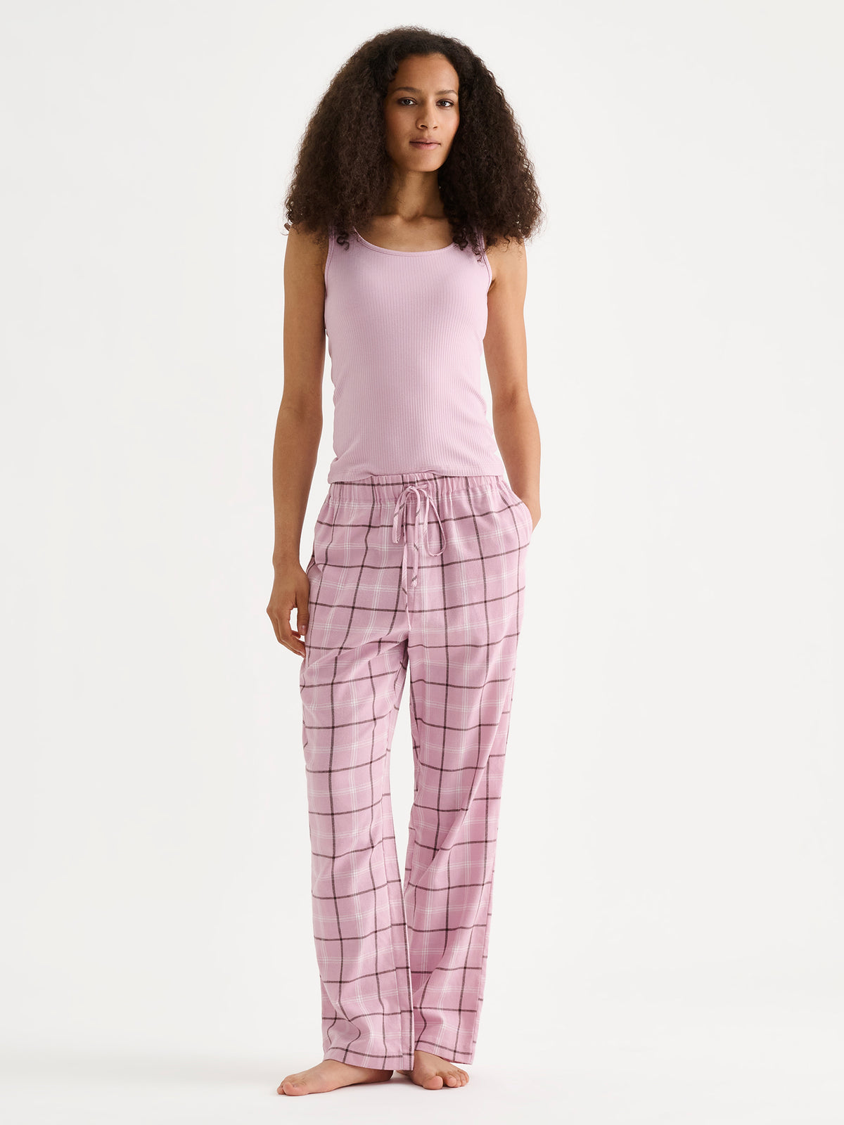 Nanso women's Tuulikki flannel pyjama pants on a model with a top. | S - 180m